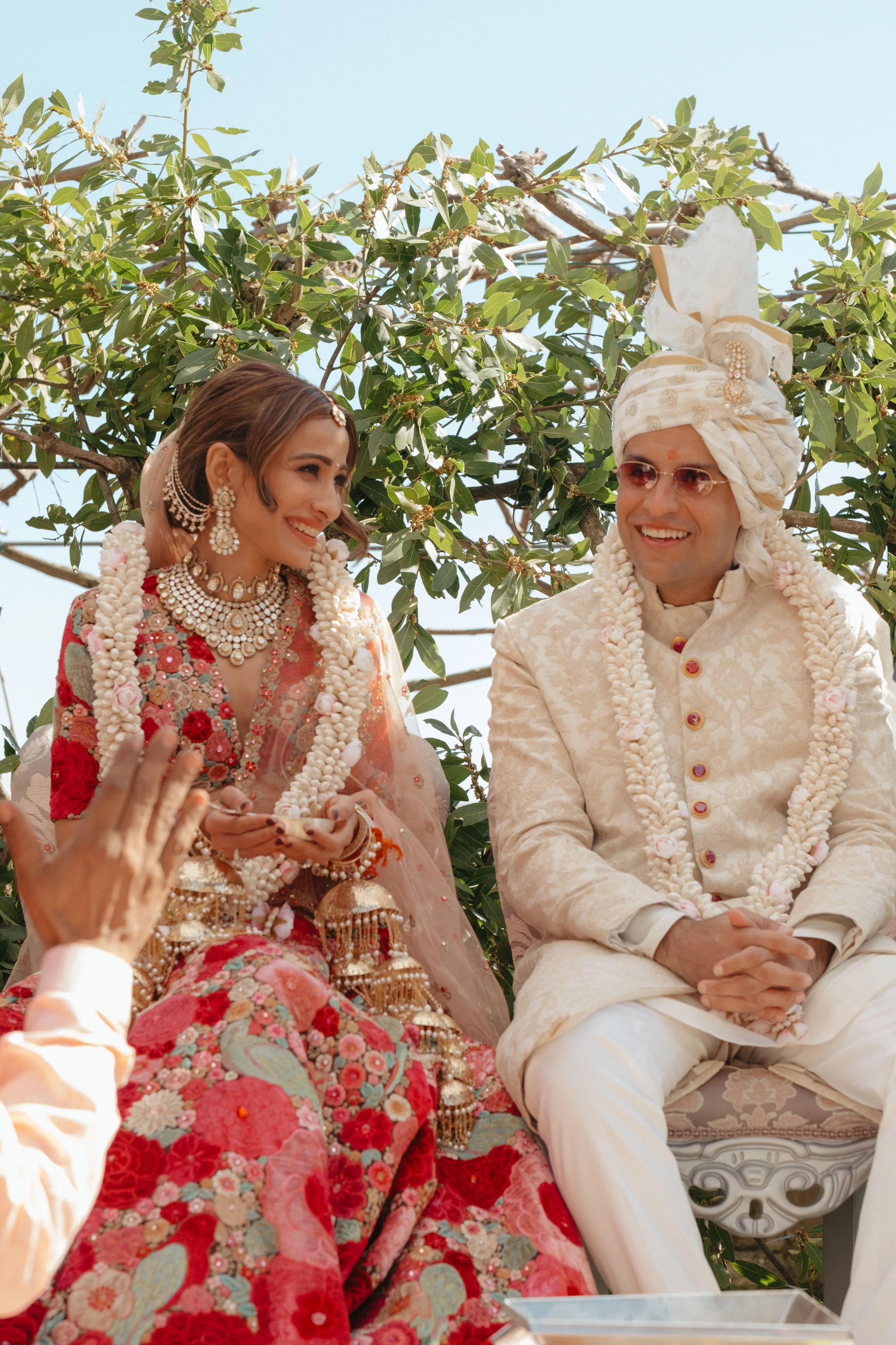 sahil-aashna-luxury-indian-wedding-il-borro-tuscany-bride-and-groom-sitting-mandap.jpg