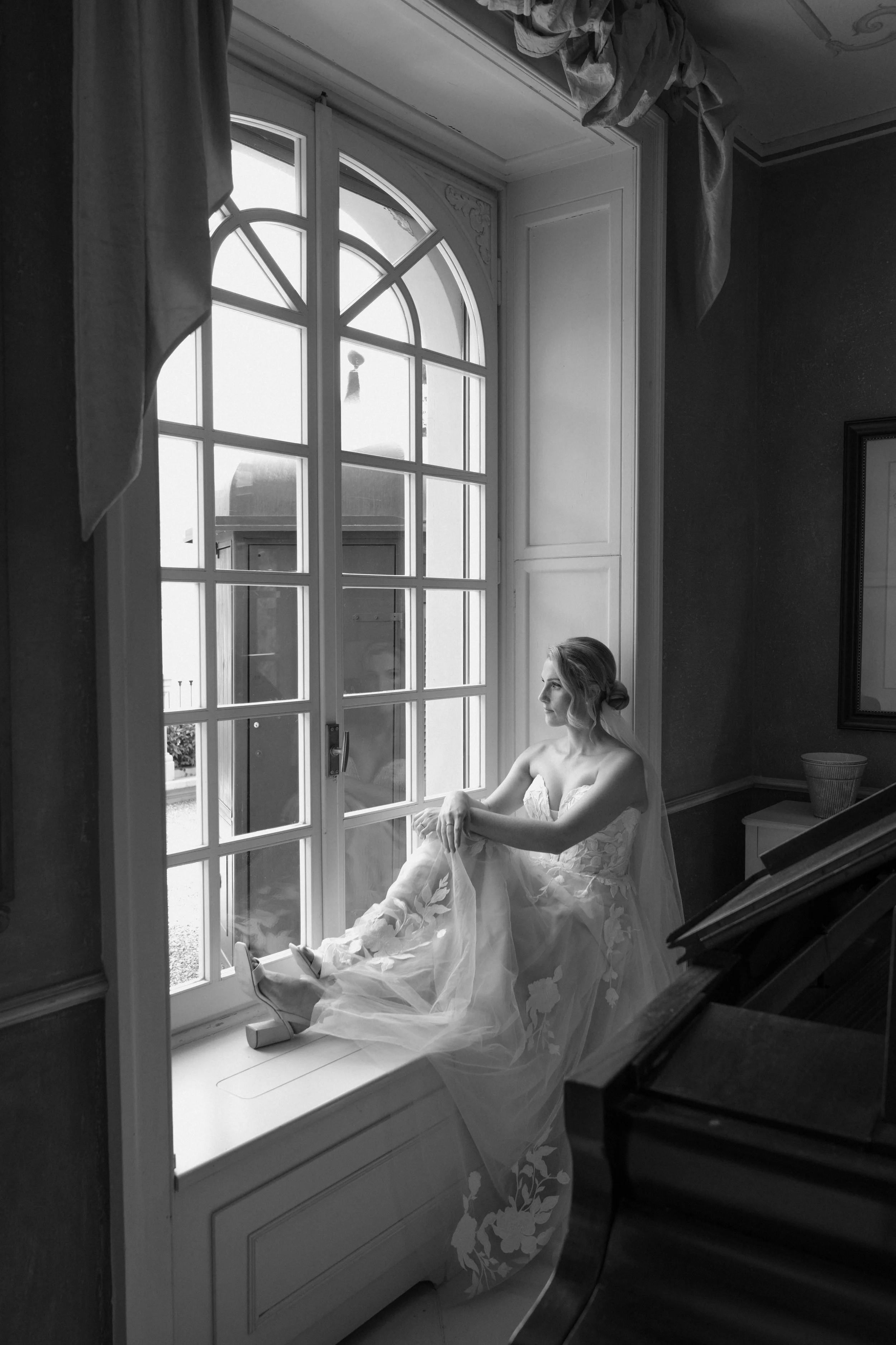 A quiet bridal moment captured at a Lake Como villa, where natural light, refined interiors, and couture details define a luxury destination wedding experience.