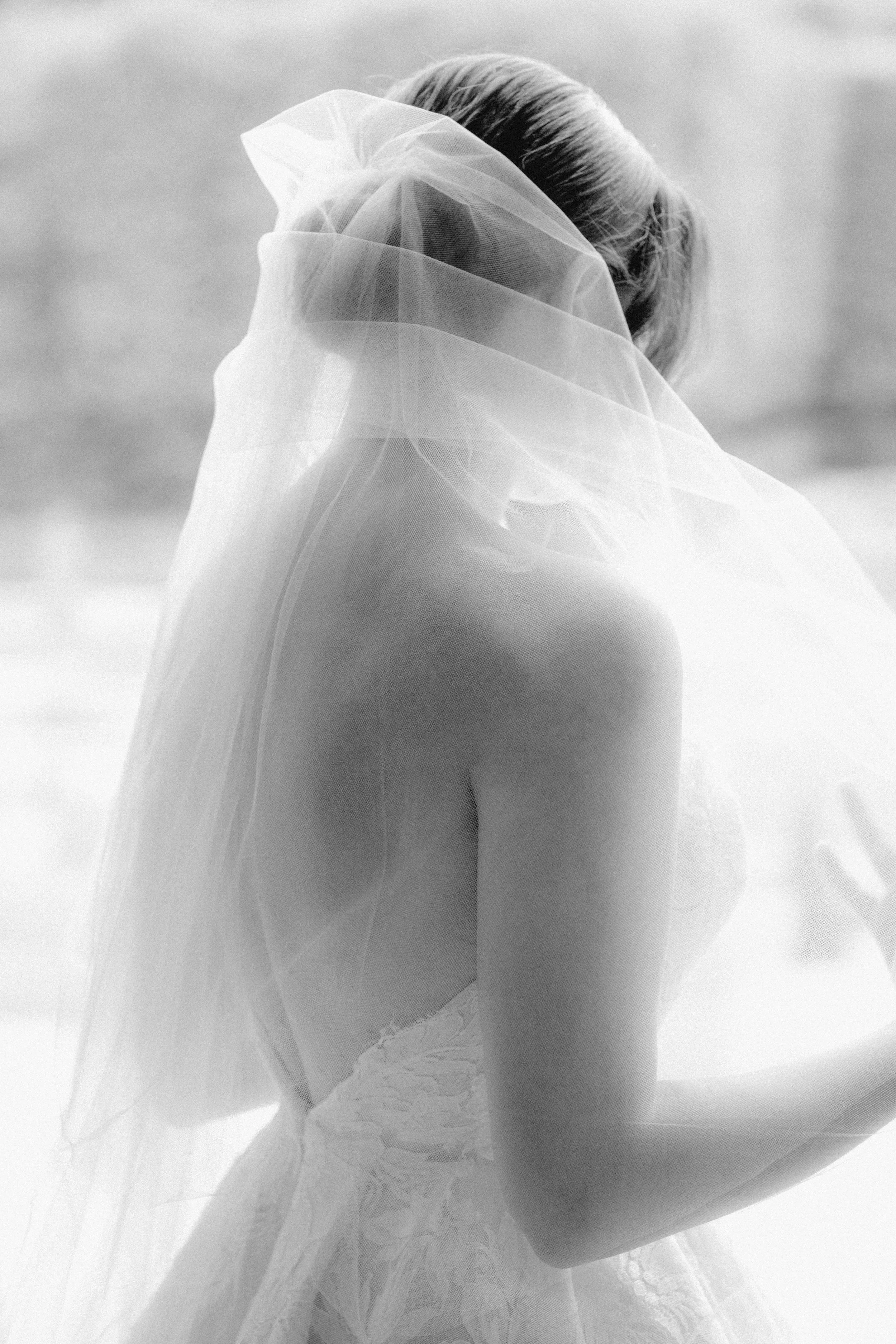 Fine art bridal portrait highlighting delicate textures, soft light, and timeless elegance for a refined luxury wedding aesthetic.