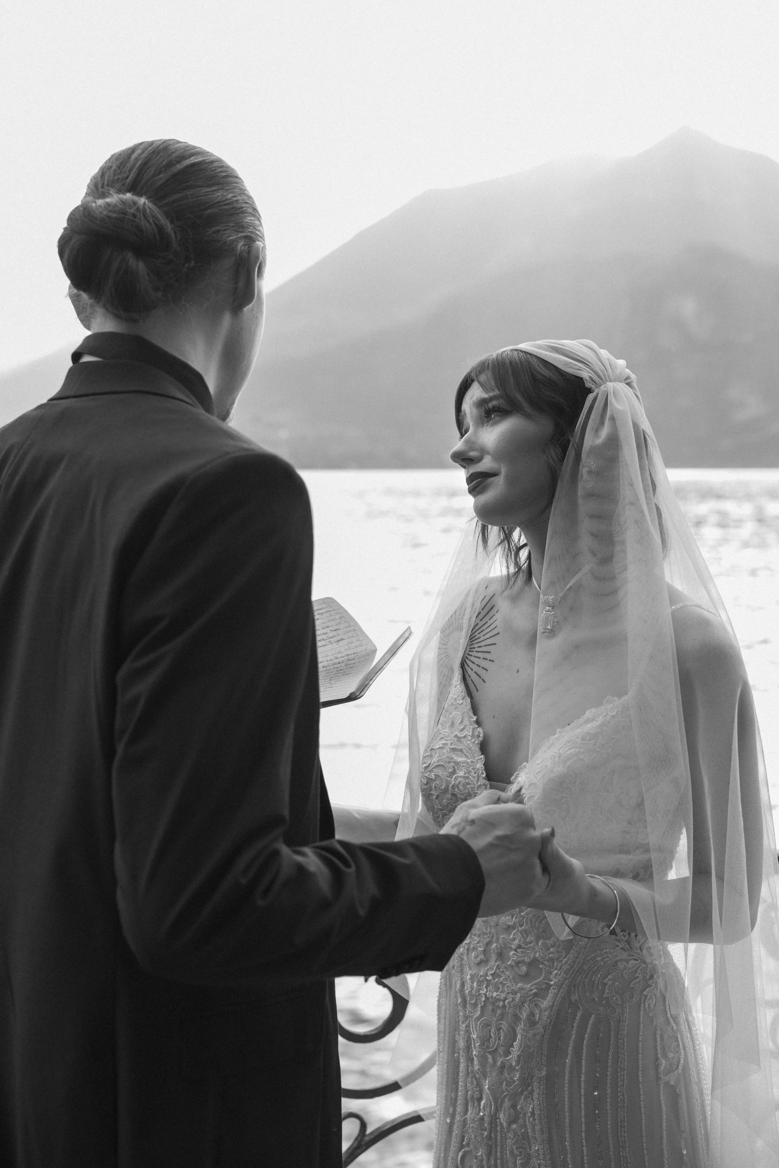 An intimate wedding ceremony at Villa Monastero on Lake Como, captured in black and white with a timeless, documentary wedding photography style.
