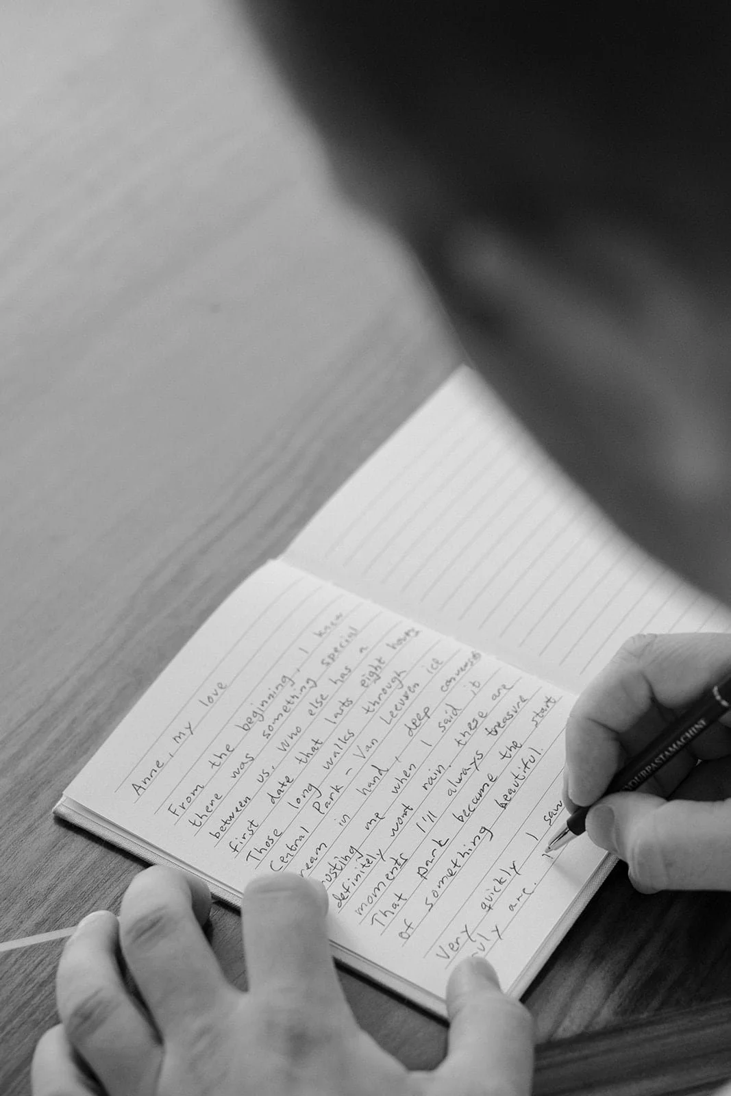 Intimate moment of handwritten vows being written before a destination wedding in Tuscany, photographed in natural light.