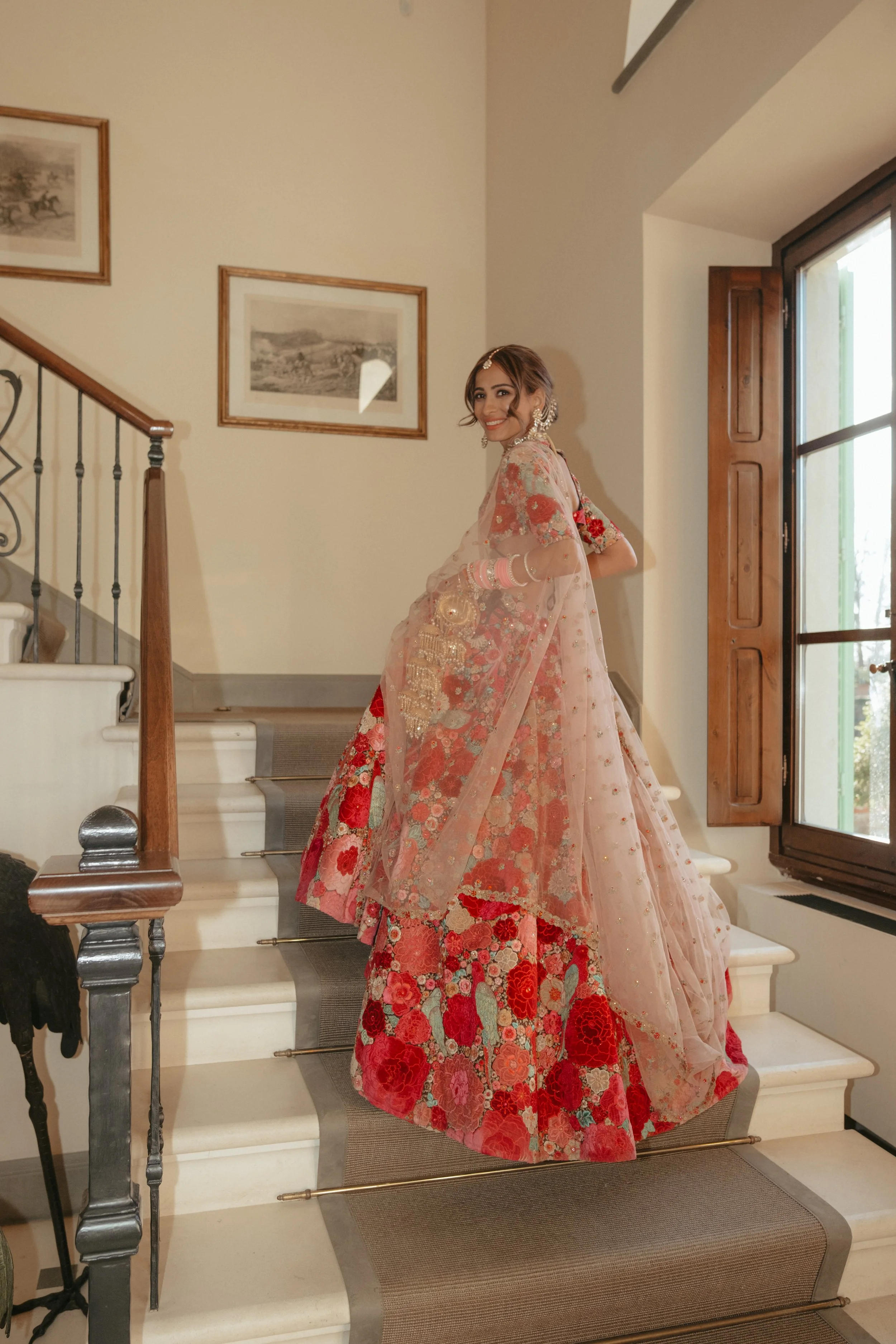 Elegant Bride Descending the Historic Stone Staircase at Il Borro Estate.jpg