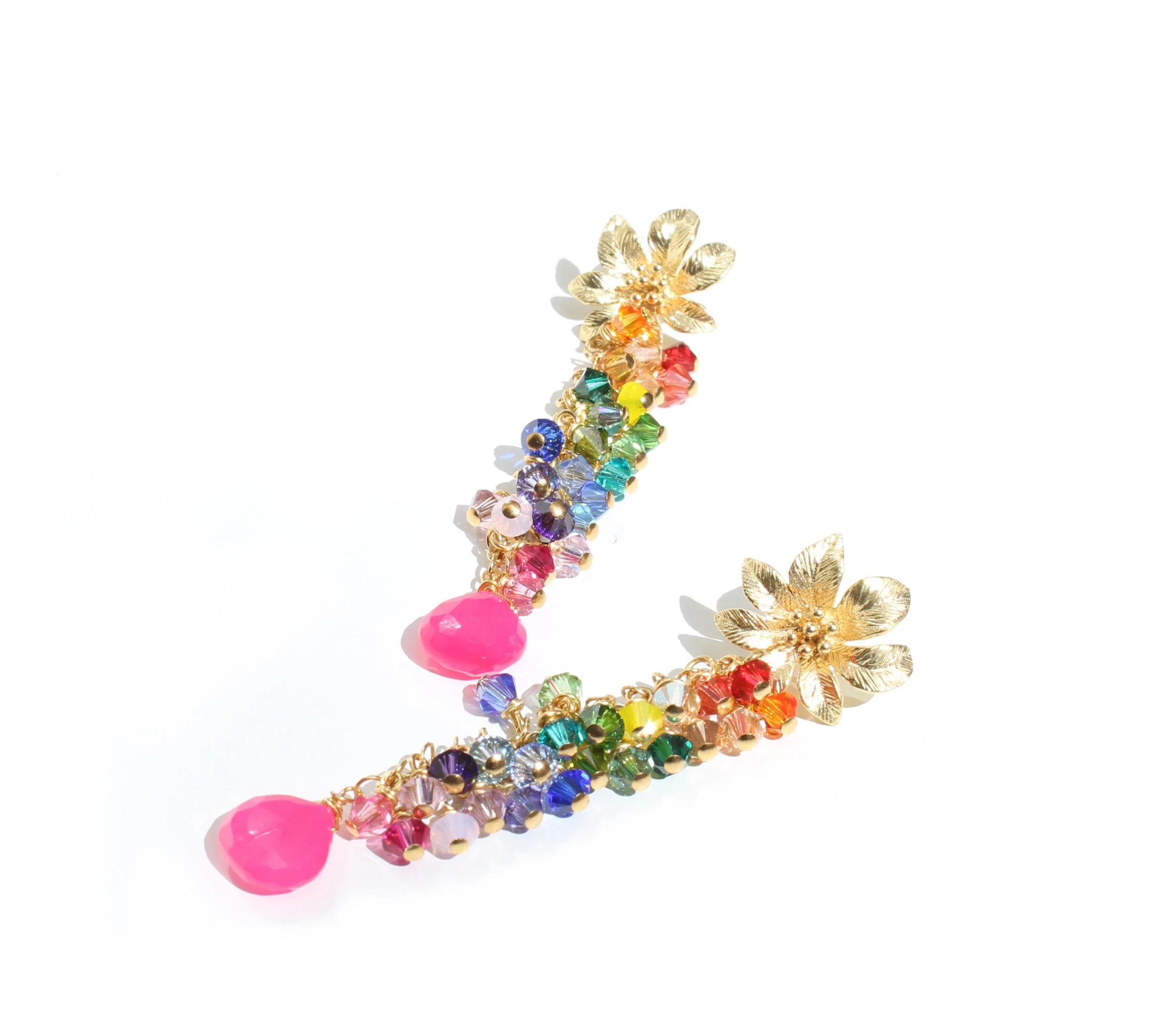 Colorful floral-shaped earrings with rainbow beads and pink teardrop charms on a white background.