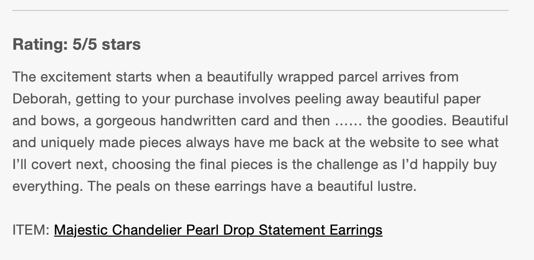 Text describing a review or product description for Majestic Chandelier Pearl Drop Statement Earrings, highlighting the process of unwrapping, peeling paper and bows, and admiring the earrings' lustrous pearls.