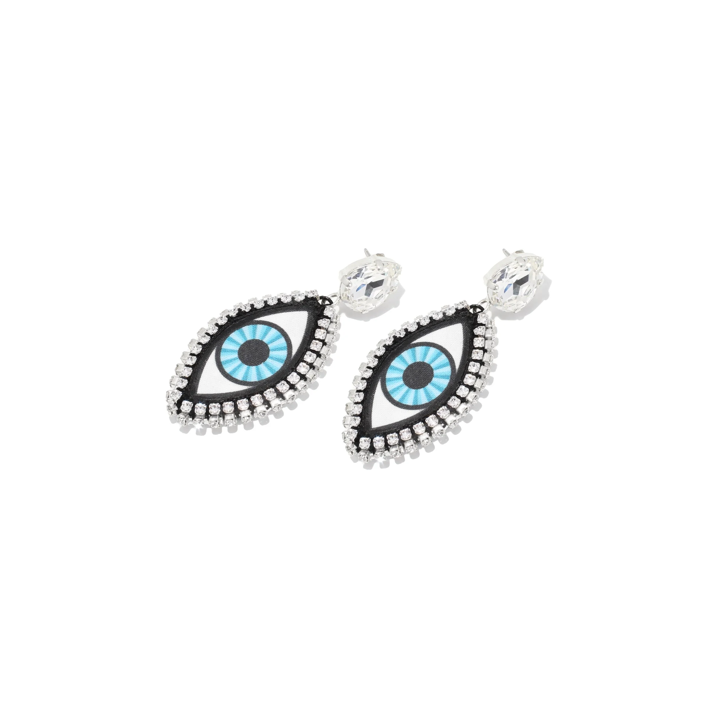 A pair of earrings with rubber eyes and a jewel border, black eyes, and blue ringed irises.