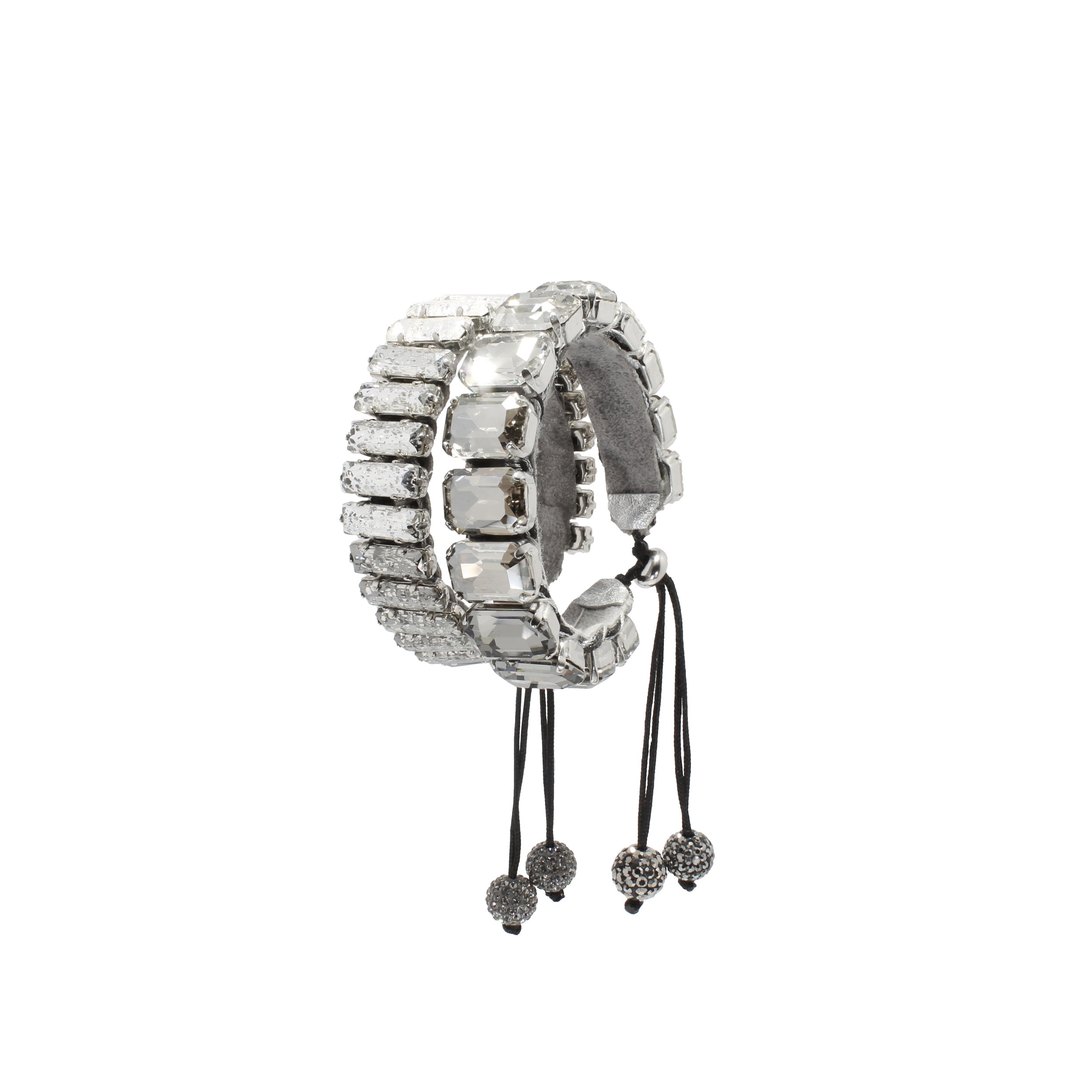 Silver-toned jewelry bracelet with large faceted clear stones and black adjustable cords with decorative bead charms