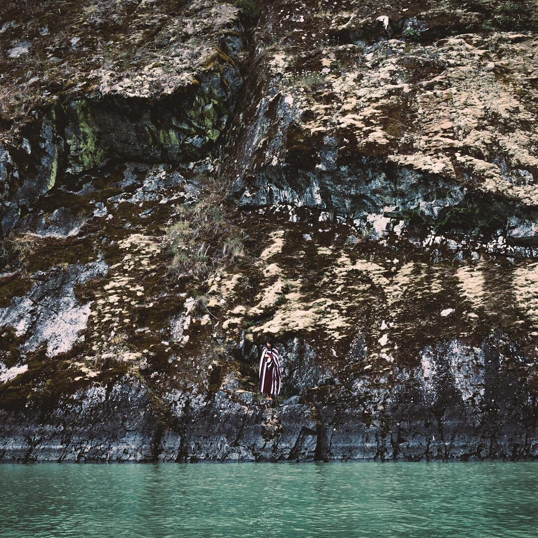 Under pictographs in a wall above water. @audreybenyessaad. .
.
.
.
.
#lillooetlake #pemberton #seatosky #explorebc #squamishadventure #awesupply #pnwonderland #pnw #beautifulbc #CanonCanada150 #nomadstories #pictograph