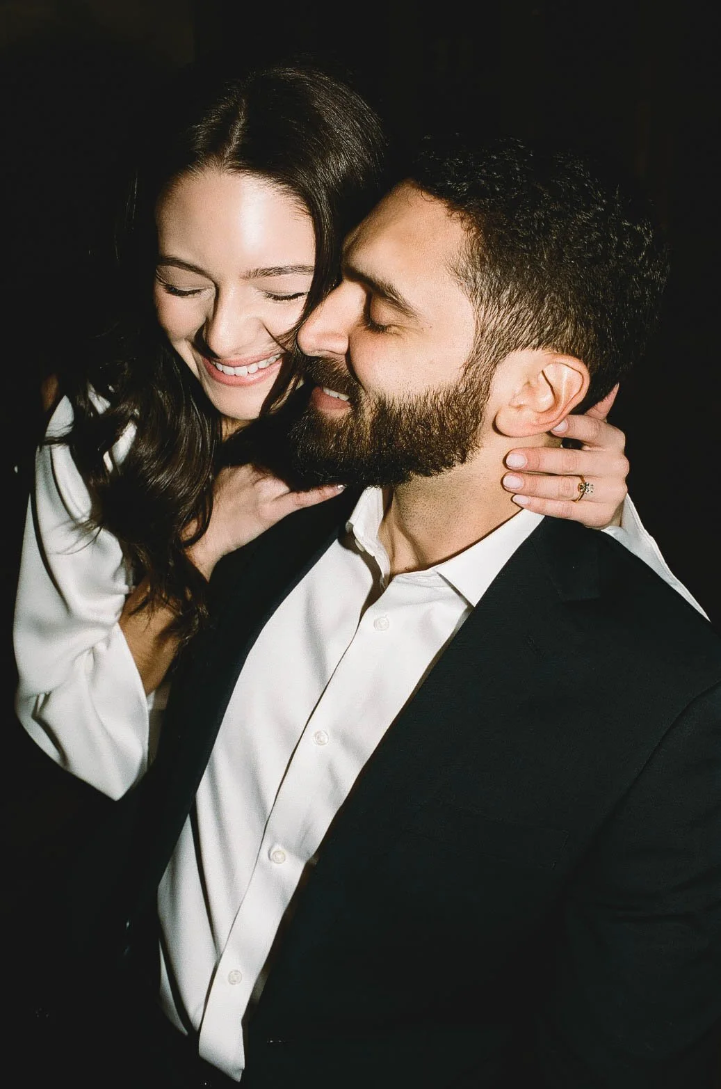 Authentic analog film photograph of a couple sharing affection