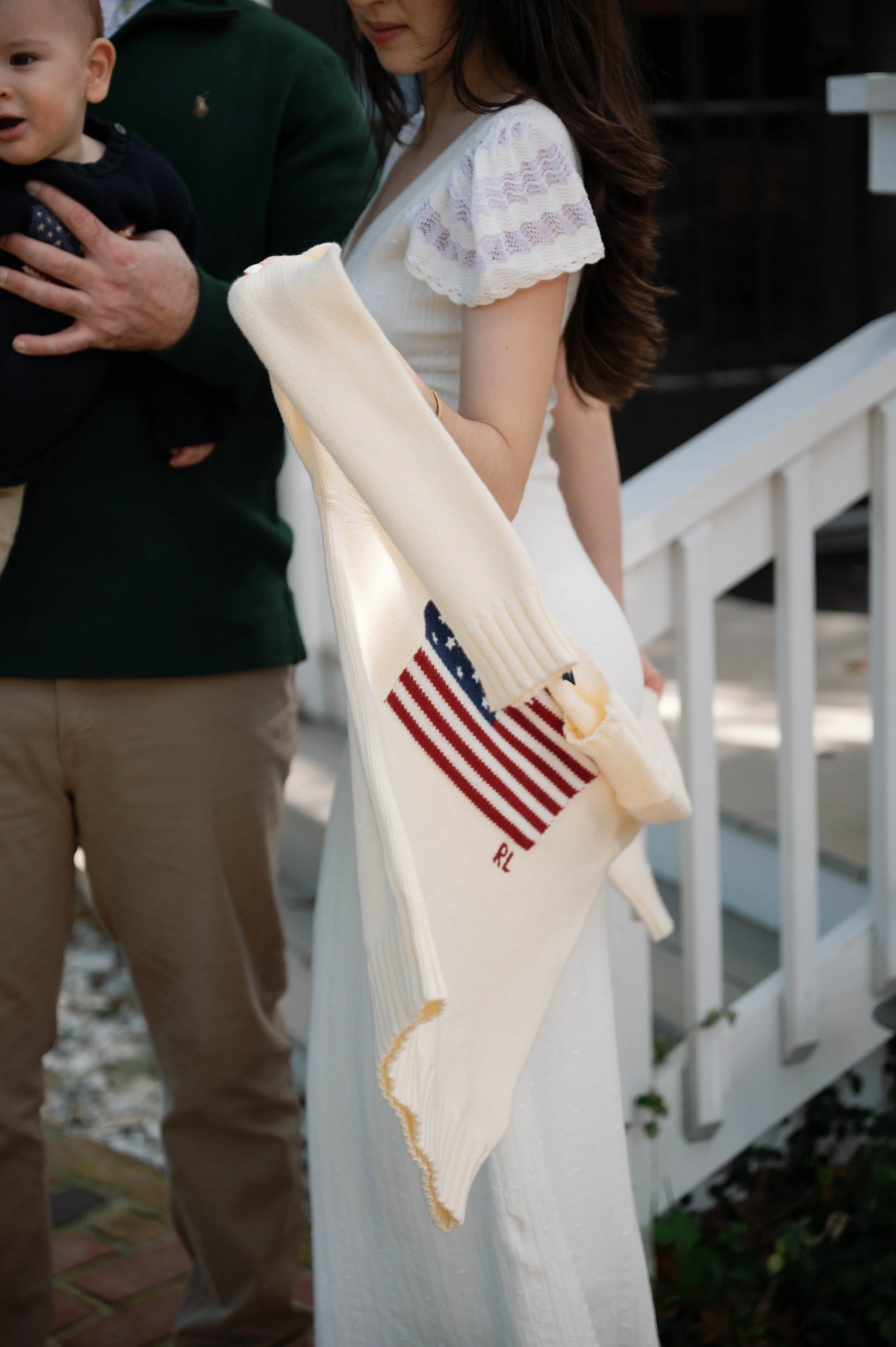 Family laughing together by gardens at golden hour in New Smyrna Beach