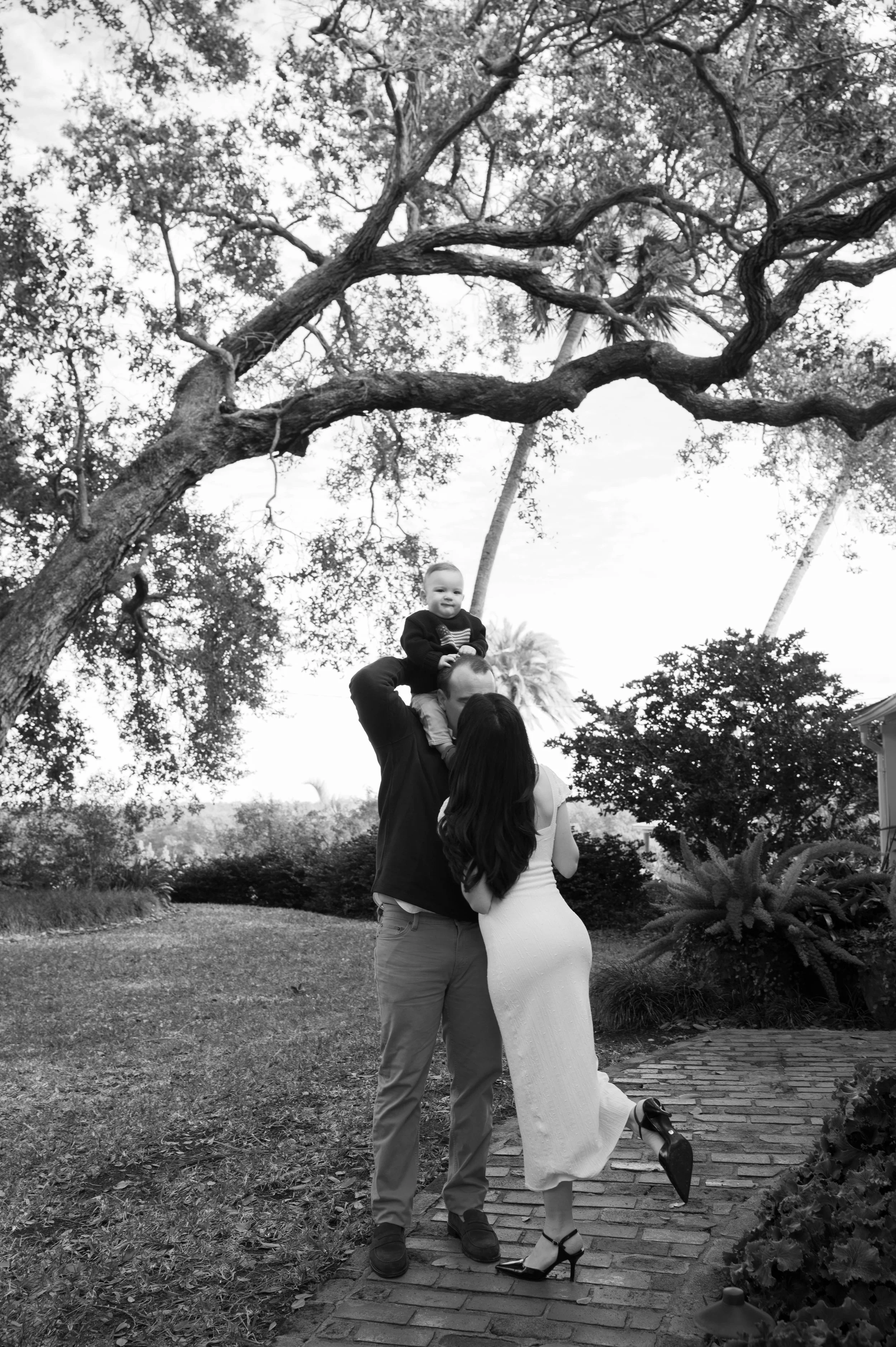 Parents holding hands with their kids on Daytona Beach during a relaxed family session
