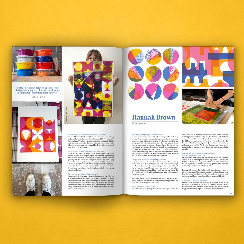 An open magazine featuring colorful abstract art and a woman holding a piece of artwork, with images of painter's supplies and a person working on printmaking.
