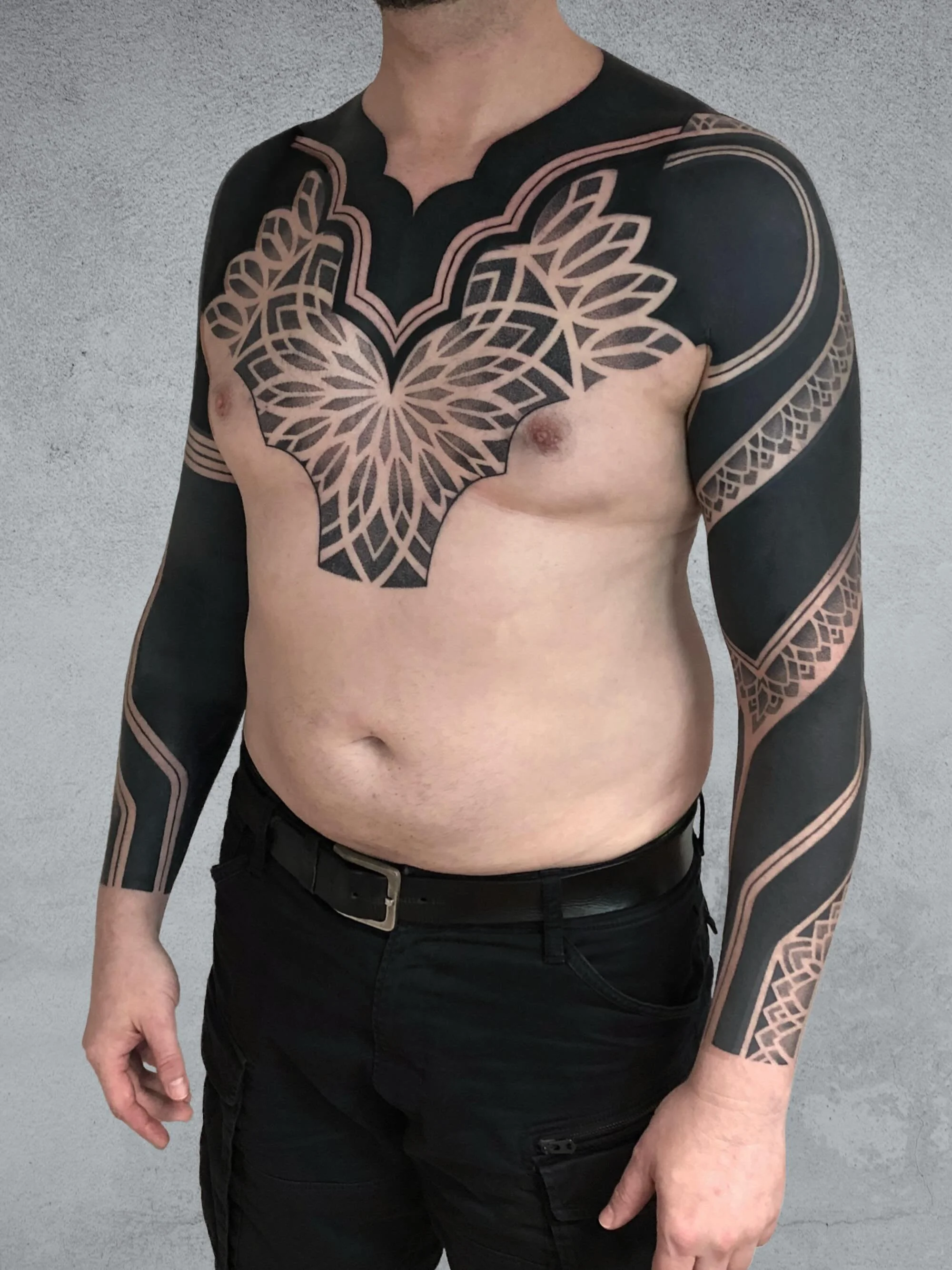 The use of black always makes for a strong tattoo powerful tattoo, a tattoo that makes a statement from a distance.
With this piece my client wanted the simplicity of the black areas to be complimented with areas of detailed dotwork to create a chest