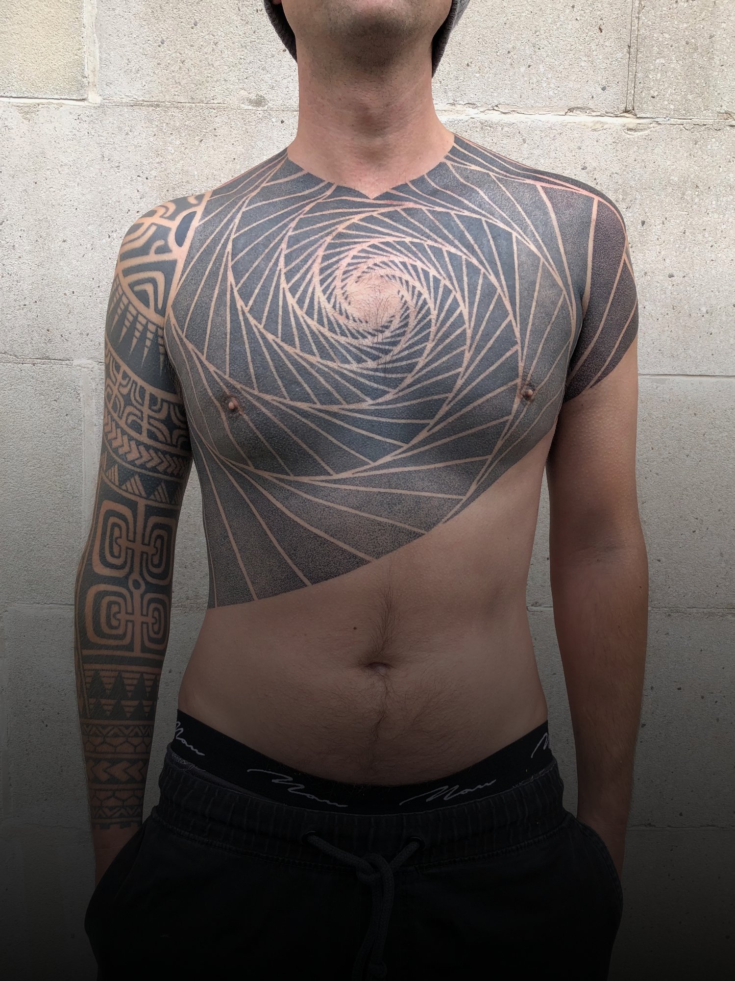 geometric-dotwork-chest-tattoo.jpg
