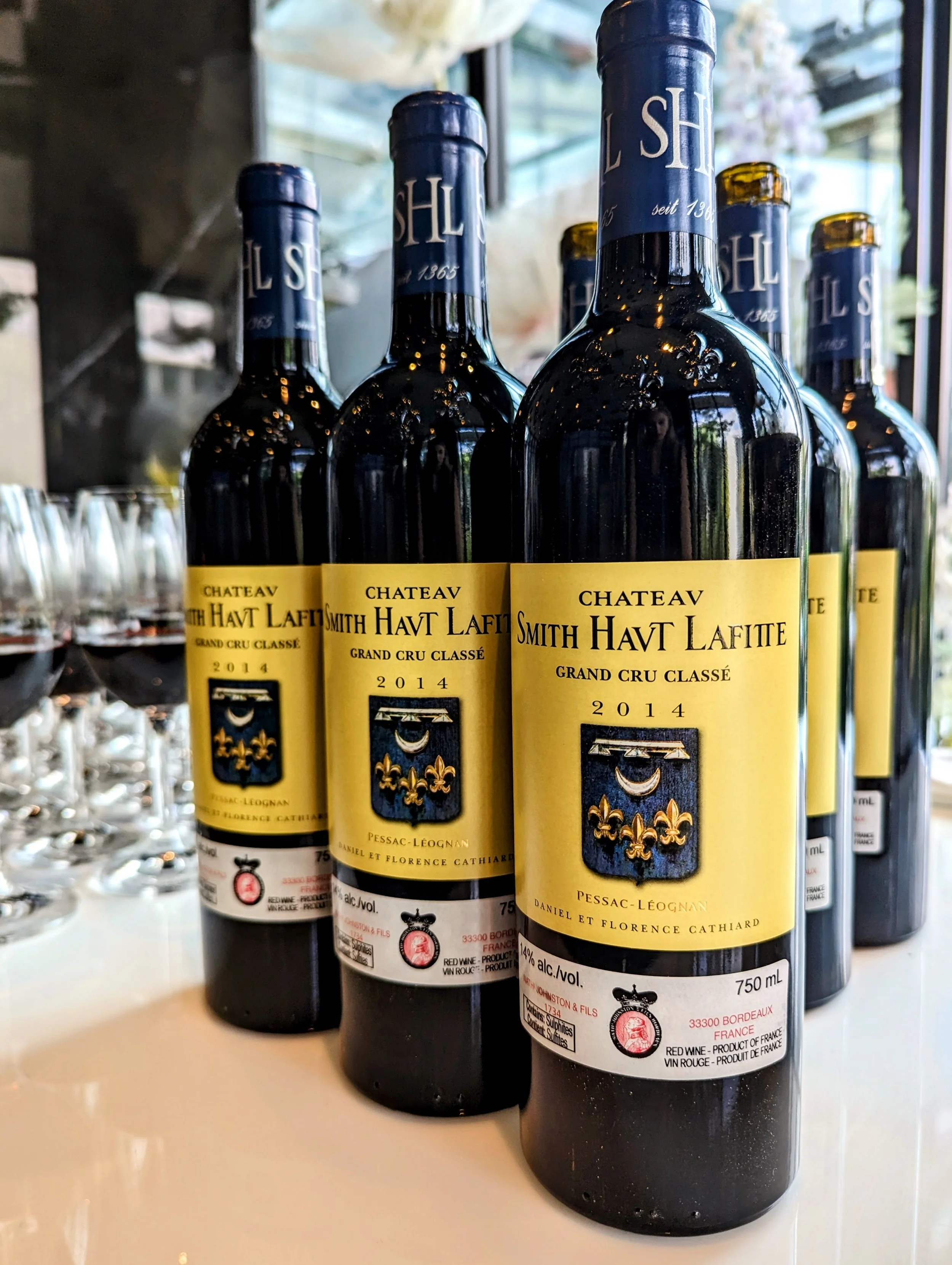 Bottles of Chateau Smith Haut Lafitte for a corporate wine experience in downtown Toronto