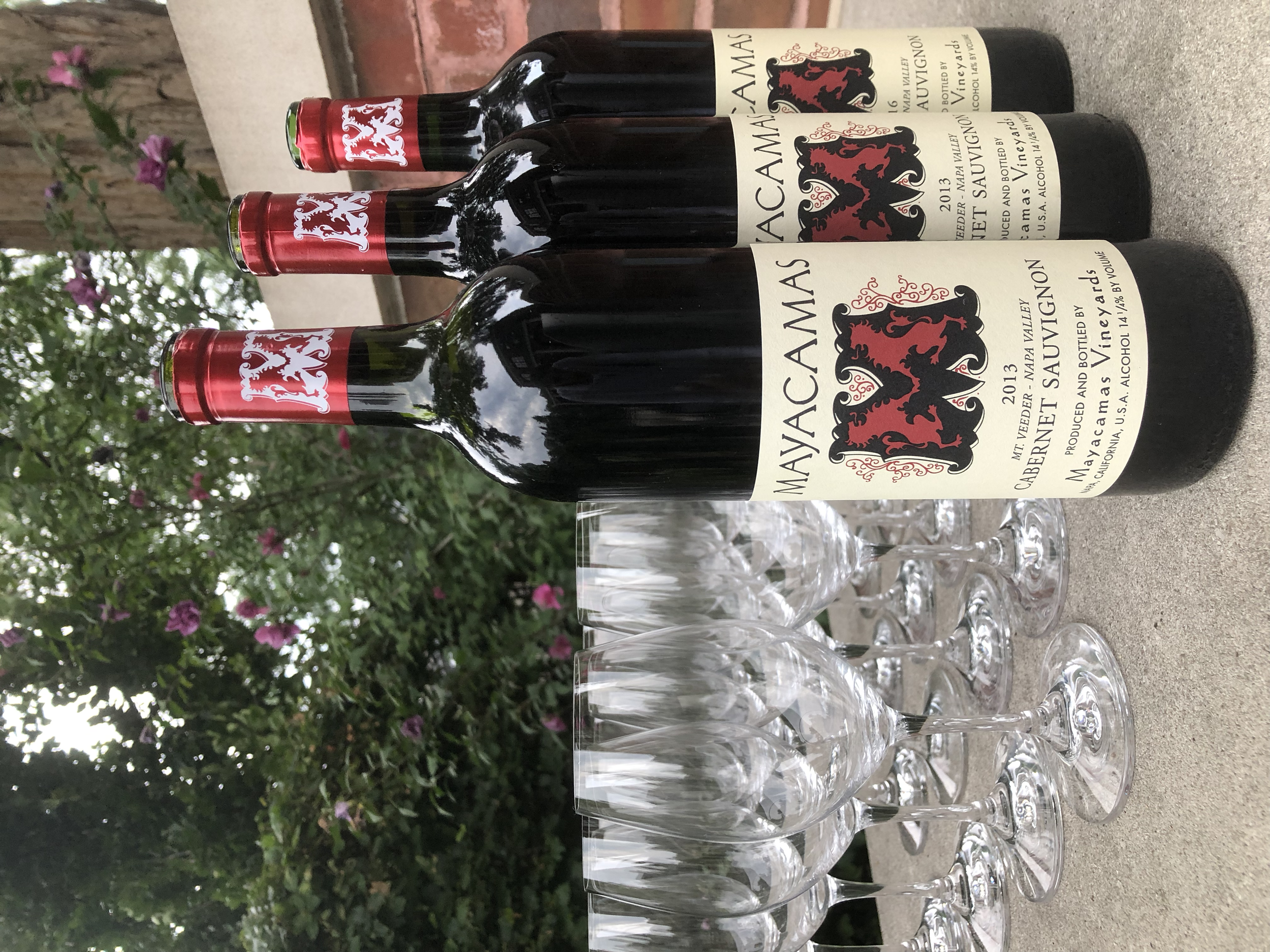 Mayacamas red wine bottles and wine glasses ready at a private event