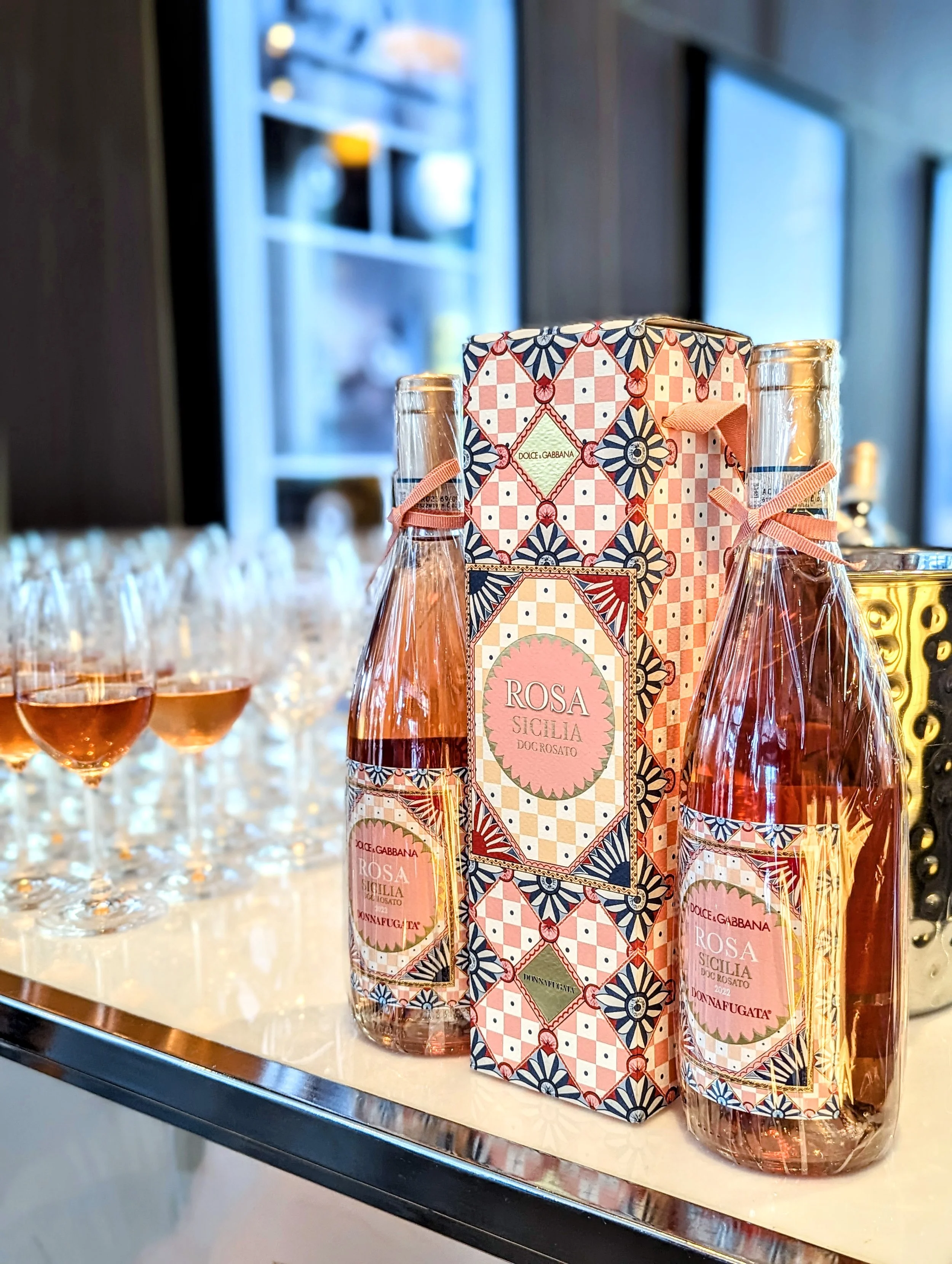 Donnafugata Dolce and Gabbana Rose wine bottles and glasses filled with wine in downtown Toronto