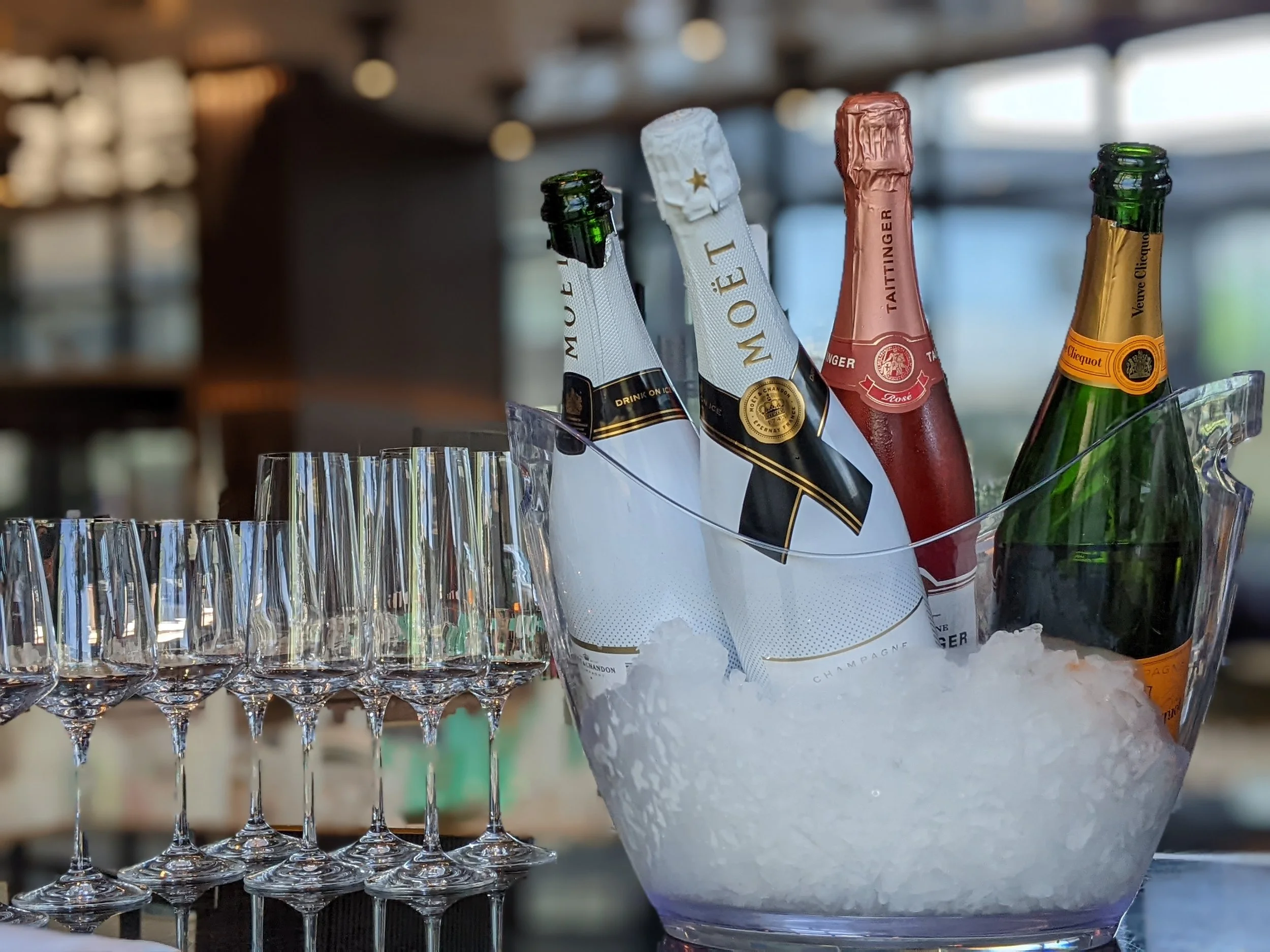 Ice bucket with chilled champagne for a corporate champagne tasting in Toronto.