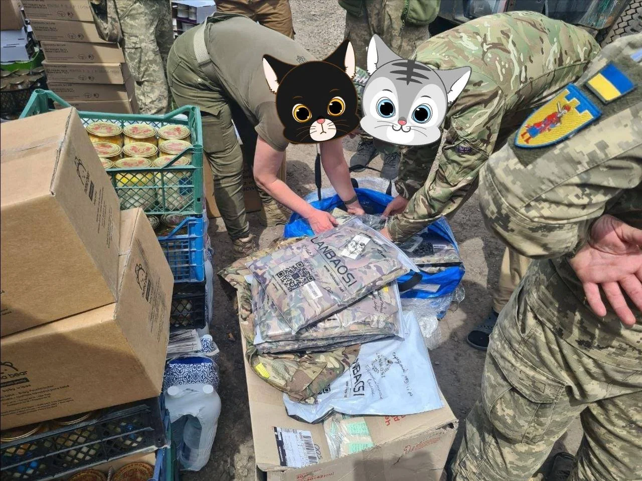 Soldiers organizing supplies, including boxes, canned food, and camouflage clothing.