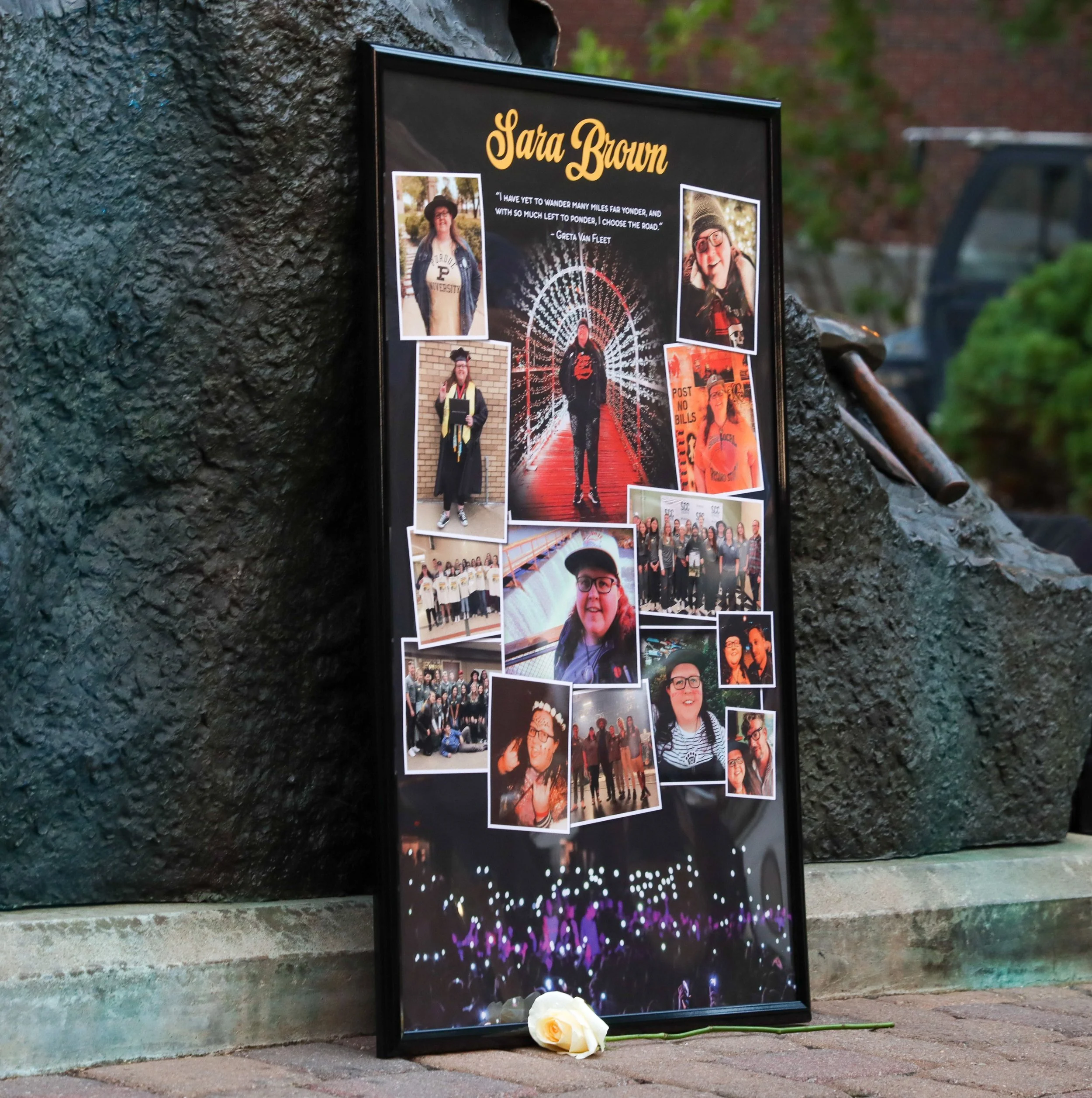 A framed photograph sits on the ground on Tuesday, Aug. 29, 2023, during the Sara Brown vigil at Purdue University in West Lafayette, Ind.