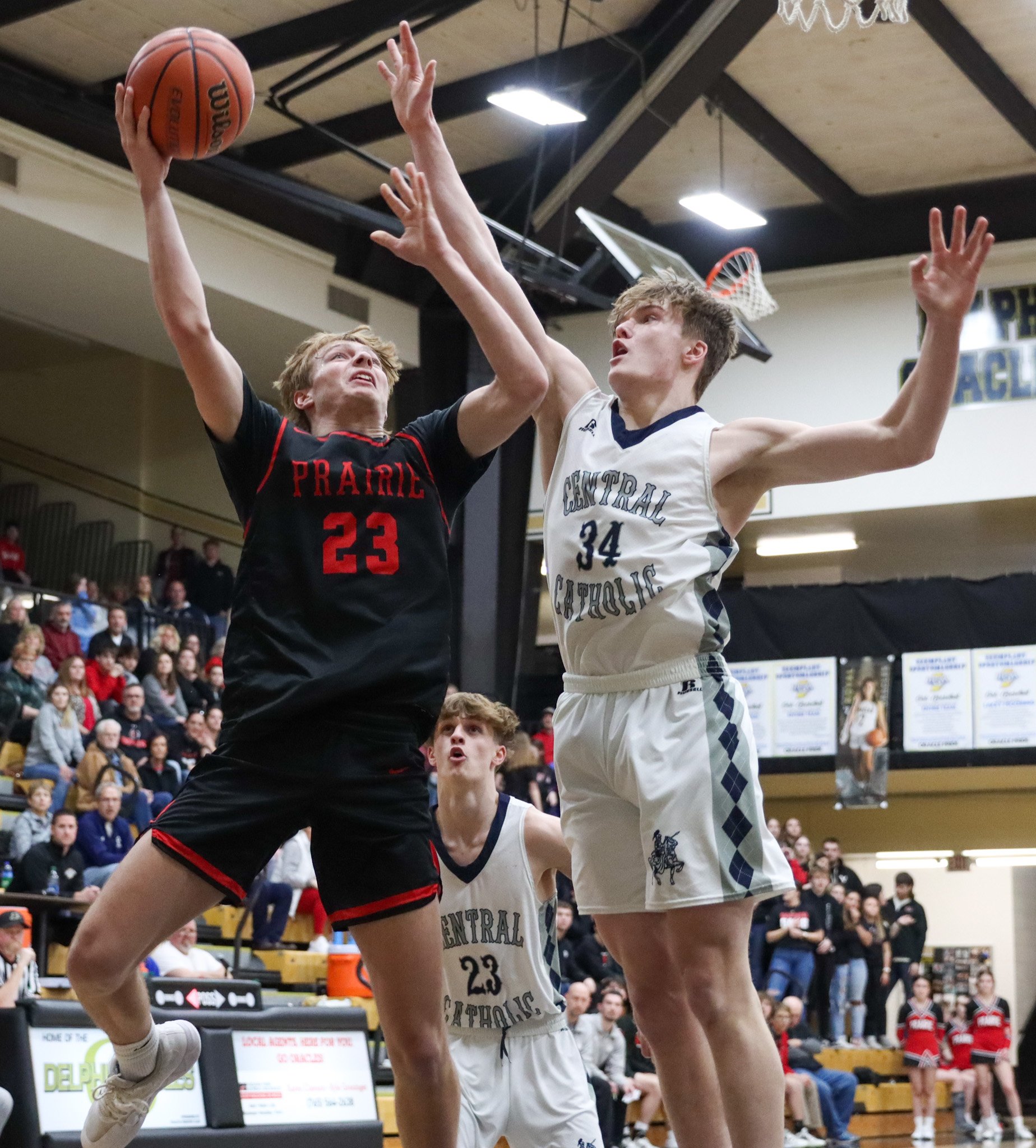 Clinton Prairie's Cayden Davis (23) shoots a layup over LCC's Albert Schwartz (34) on Friday, Feb. 23, 2023, during the IHSAA sectional semifinal at Delphi High School in Delphi, Ind.