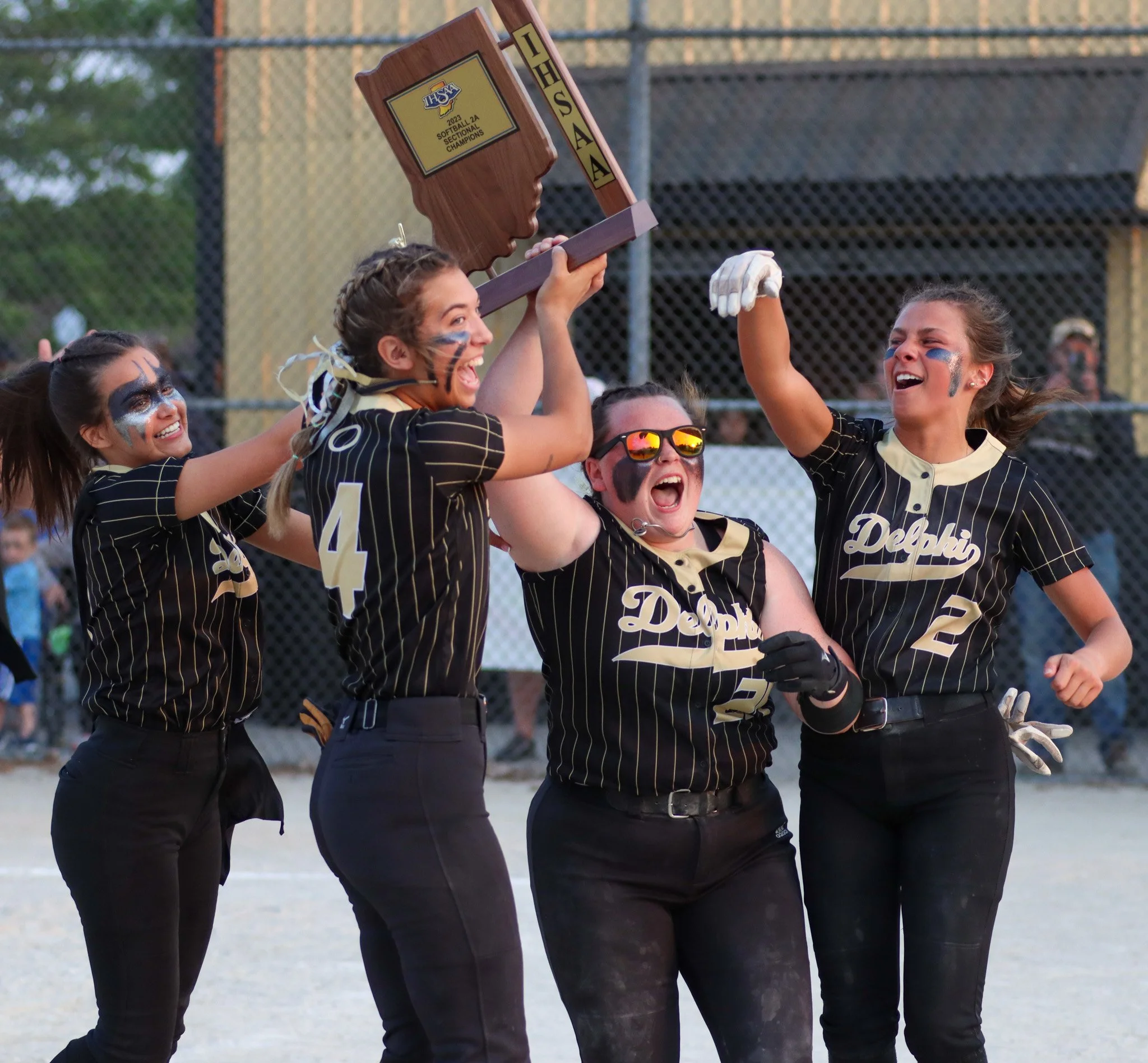 Delphi's seniors hoist the sectional trophy on Wednesday, May. 24, 2023, during the IHSAA sectional championship game at Delphi High School in Delphi, Ind.