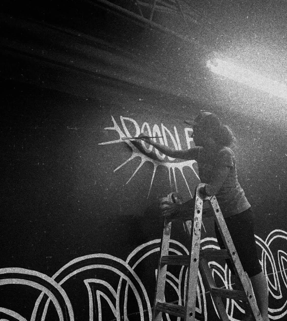 Carrie Lane donates a mural in the ViBe Creative District for community event, Doodlefest, 2024.