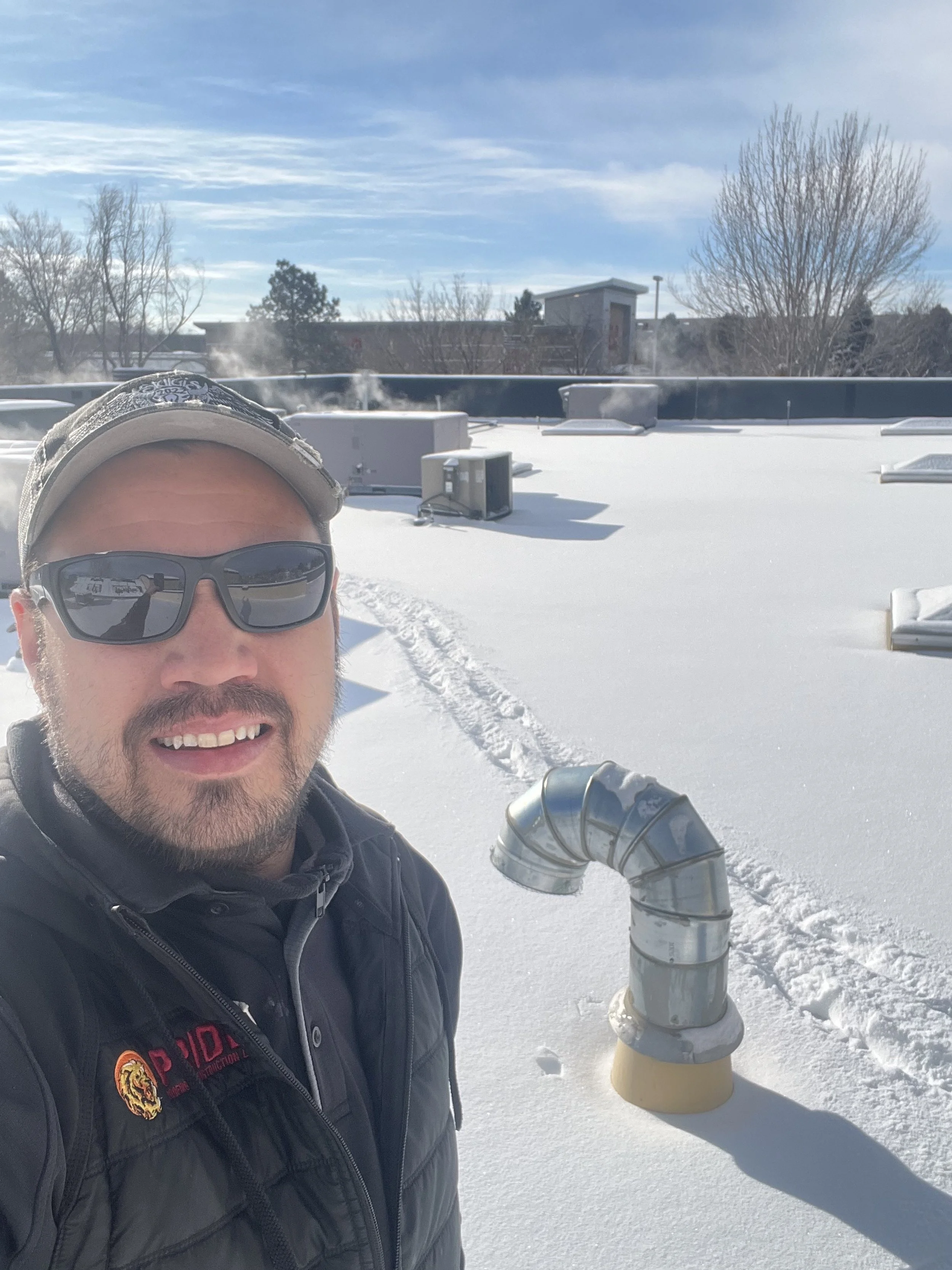 Paul on Snowy Roof.JPG