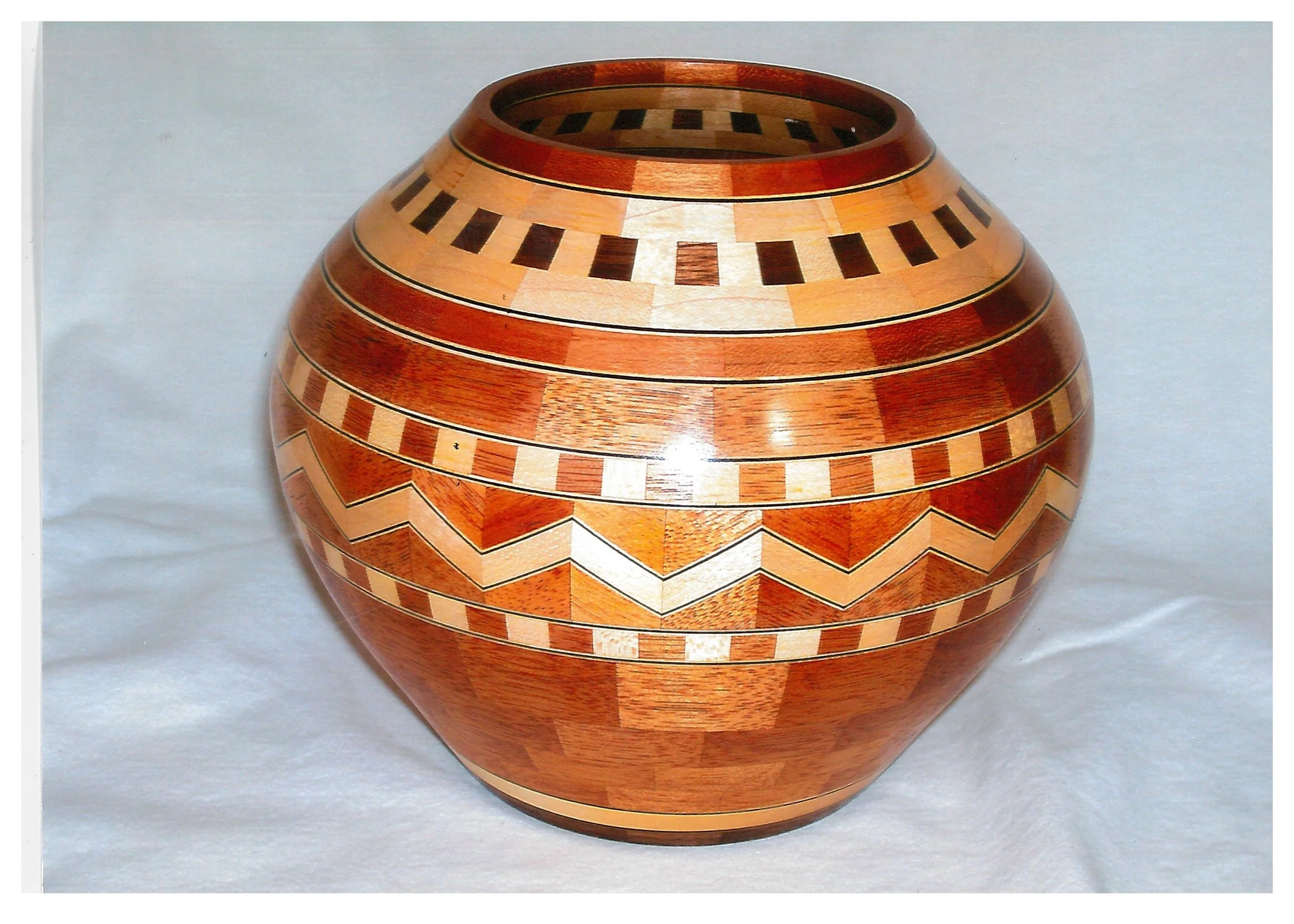 **SOLD** No. 28 $200 / 2015 Philippine Mahogany, Maple, Walnut, Dyed Maple Veneer, (503 pieces) 6 1/4 H x 8" Diameter