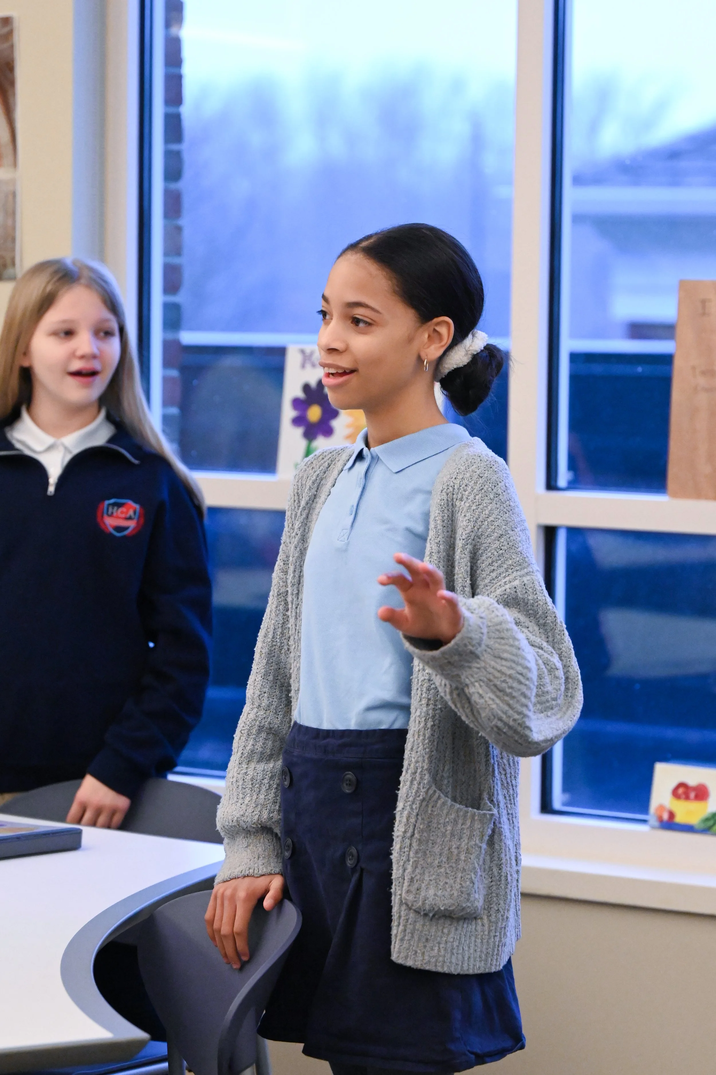 Student standing and speaking during class
