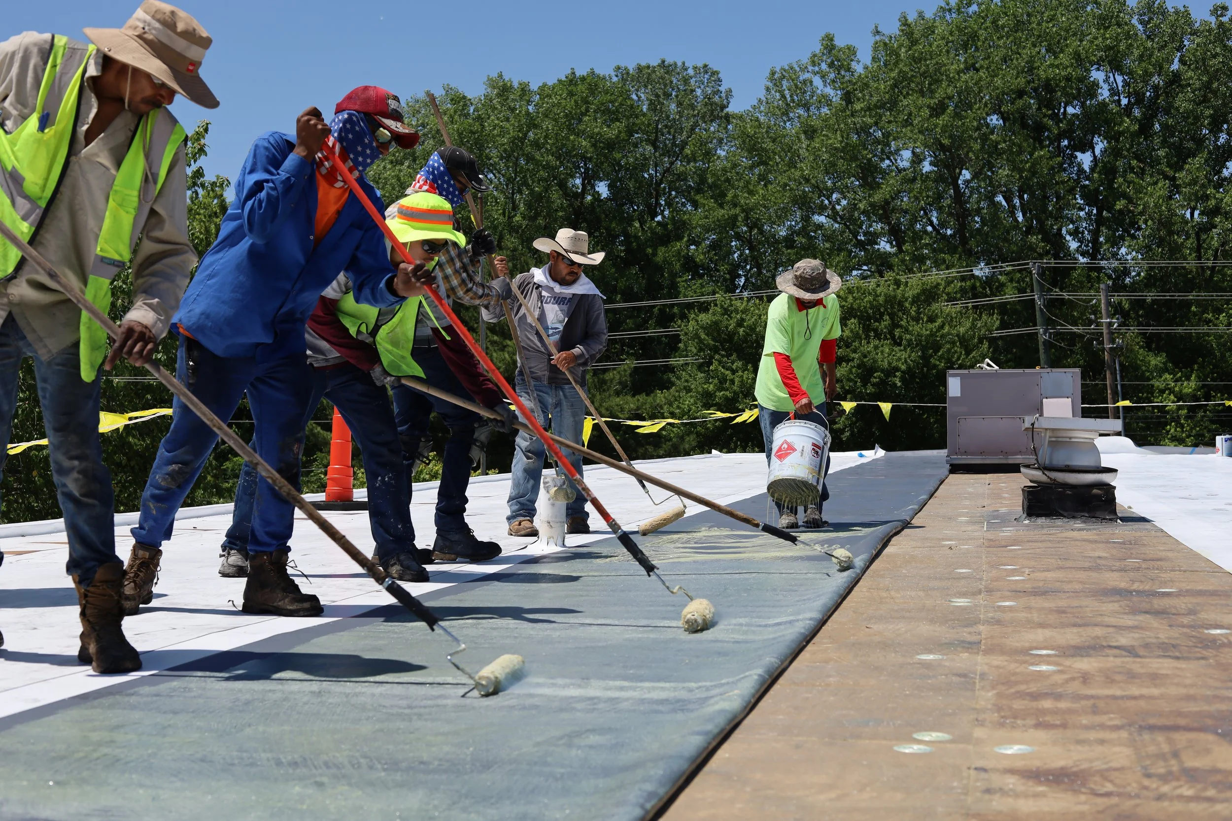 Commercial roofing workers working