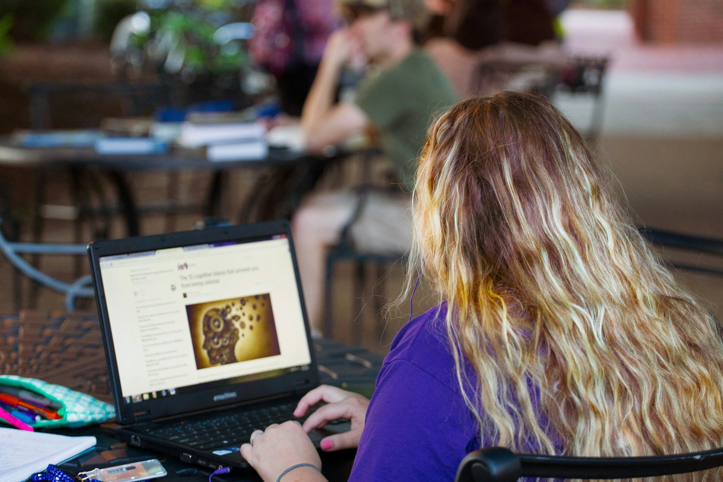 women studying looking at computer screen