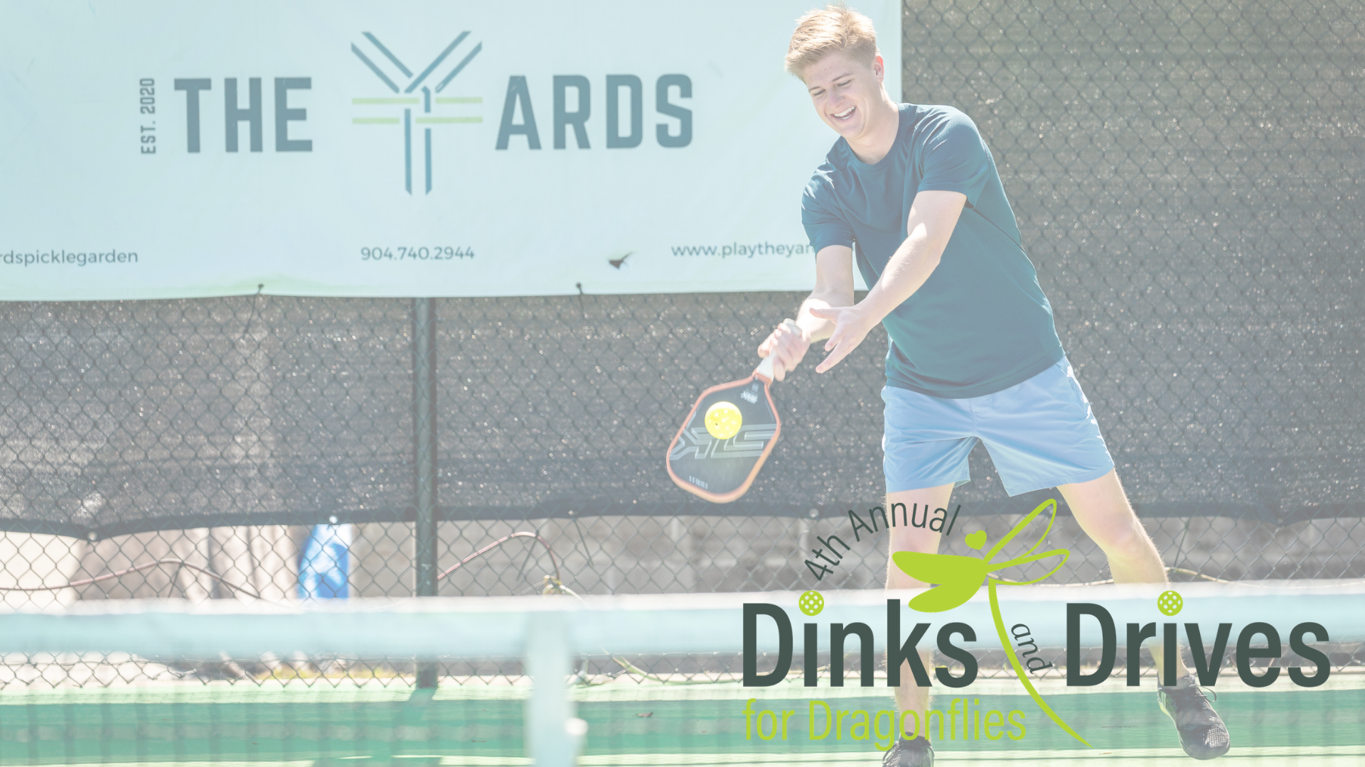 Man playing pickleball on a court at the Yards.