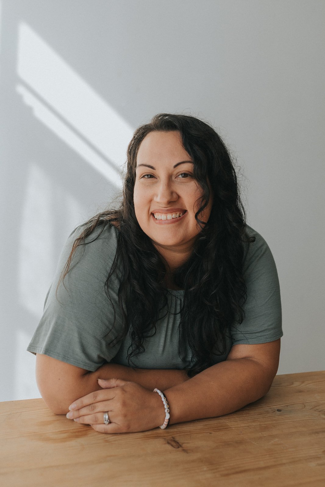 womens headshot looking dircetly in camera smiling