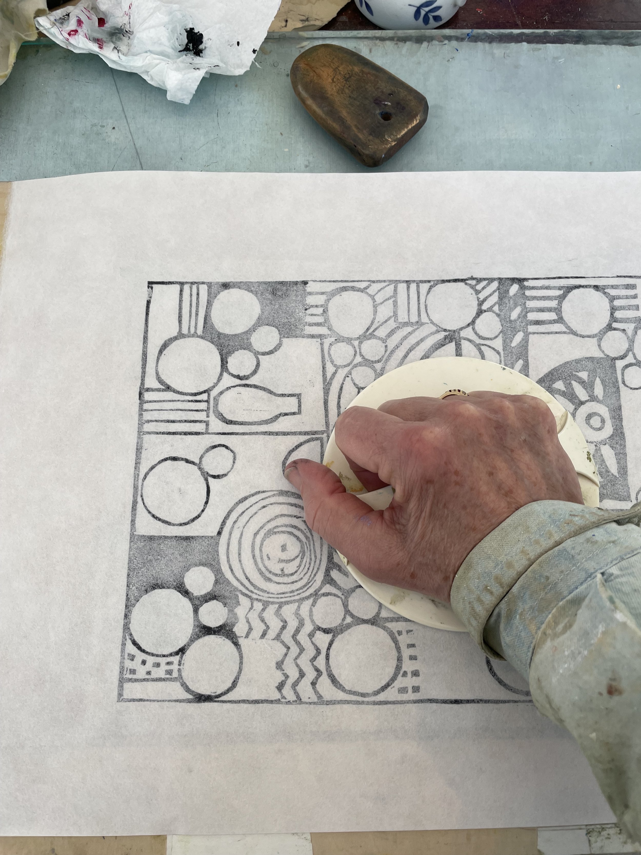 Hand printing a woodcut plate