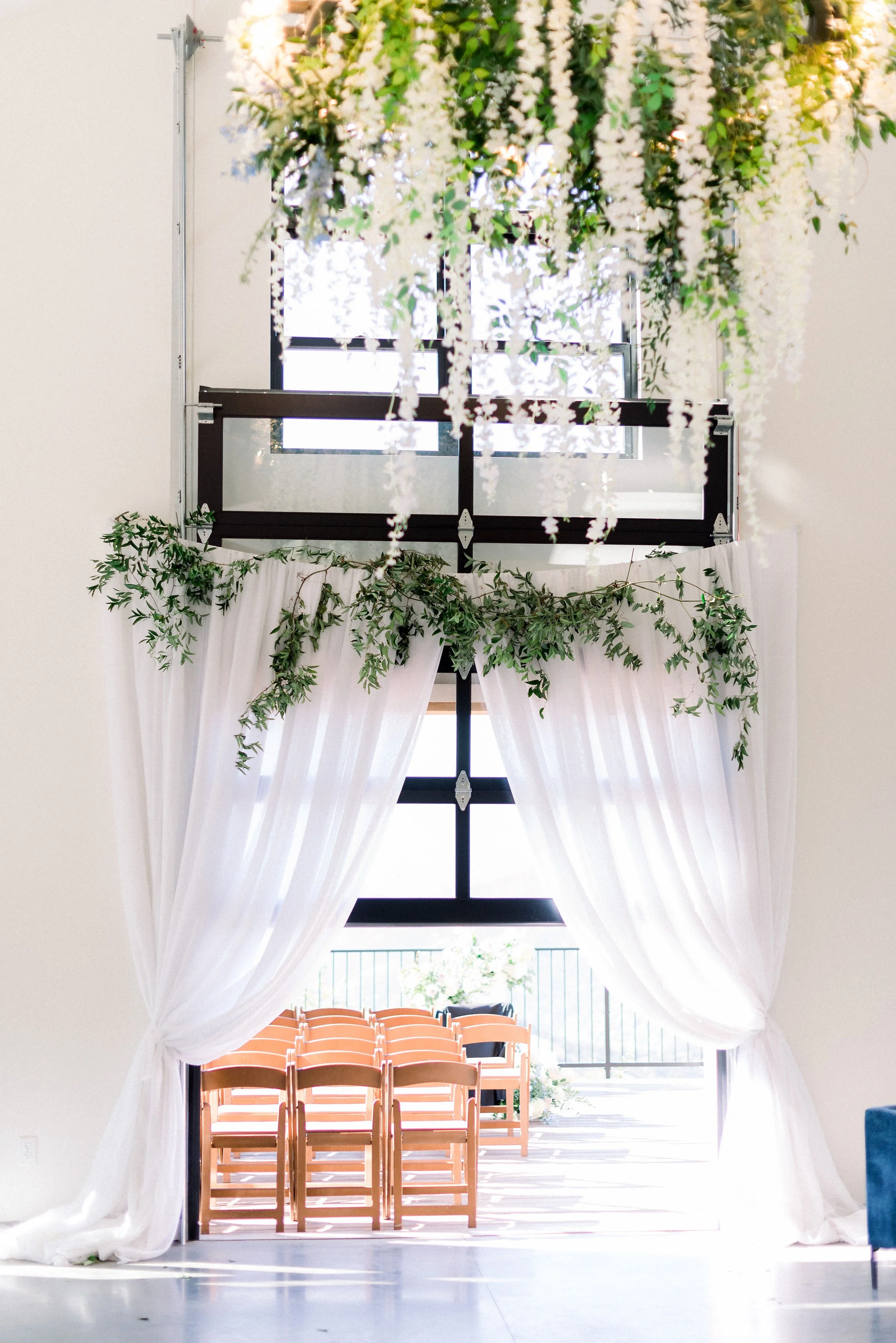 Talk about a grand entrance: curtains framing the ceremony deck are a perfect way for the bride to make her entrance.
