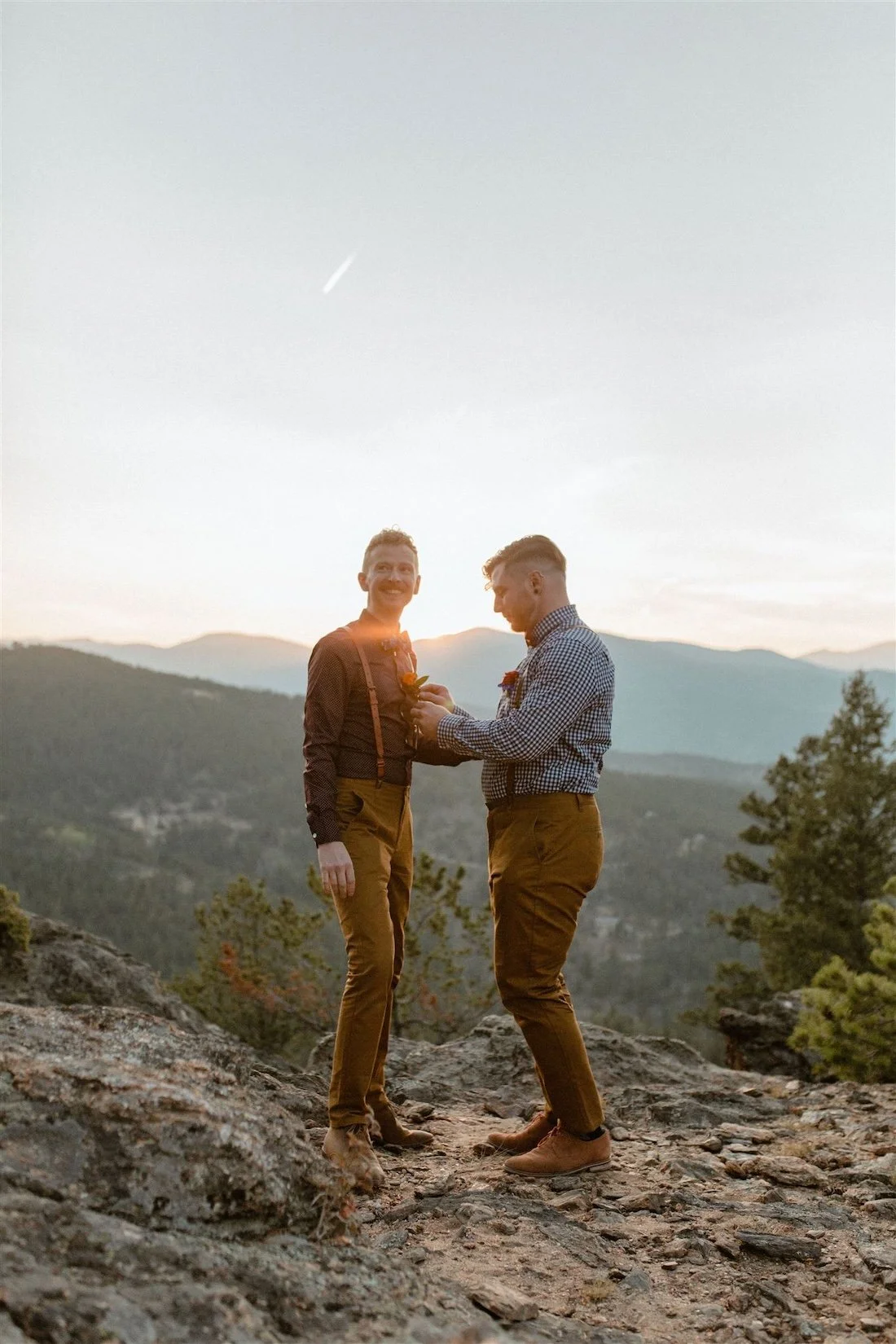 Queer wedding venue in Colorado - two grooms have take sunset photos in idaho springs