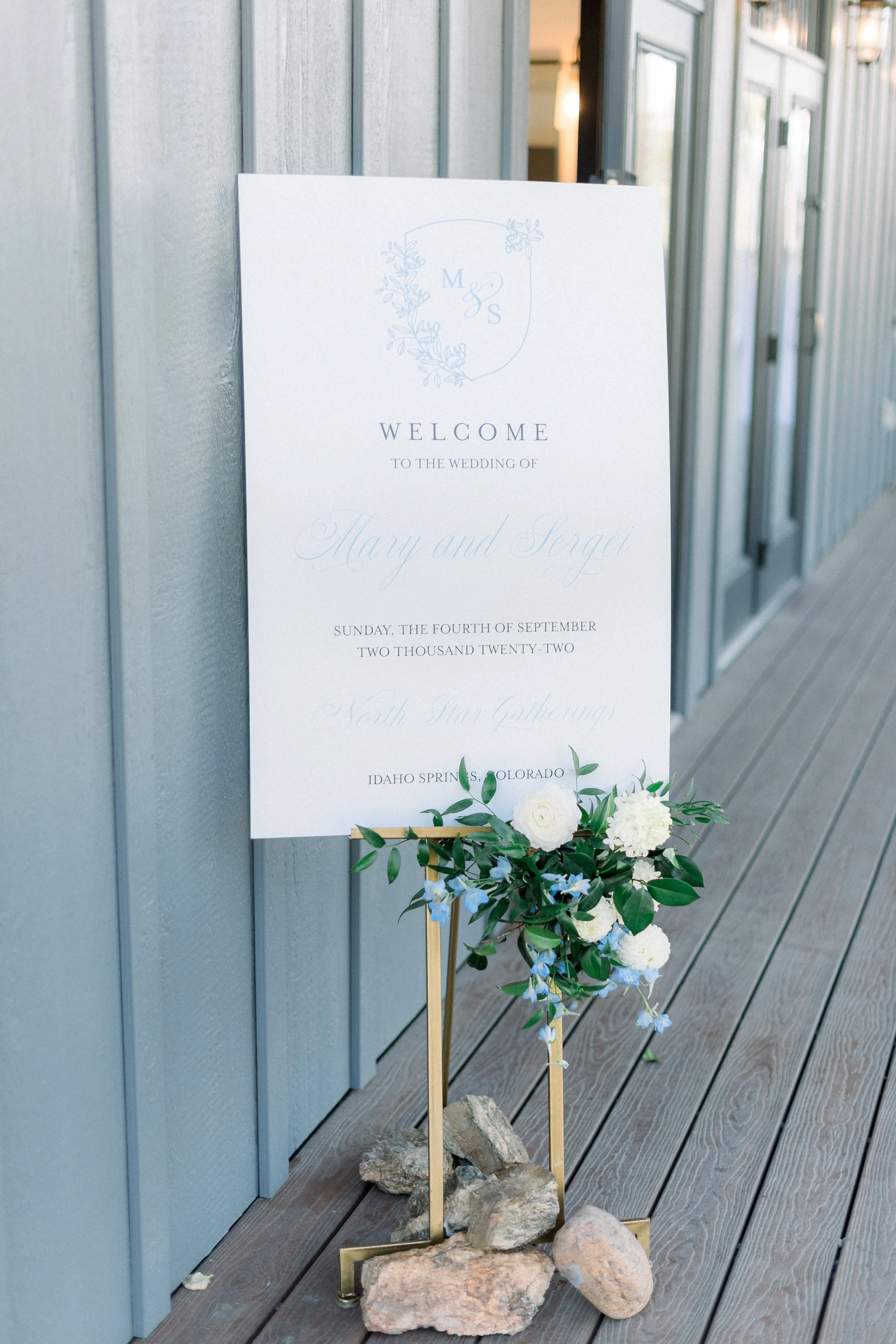 Clean and elegant white and blue wedding welcome sign ideas.