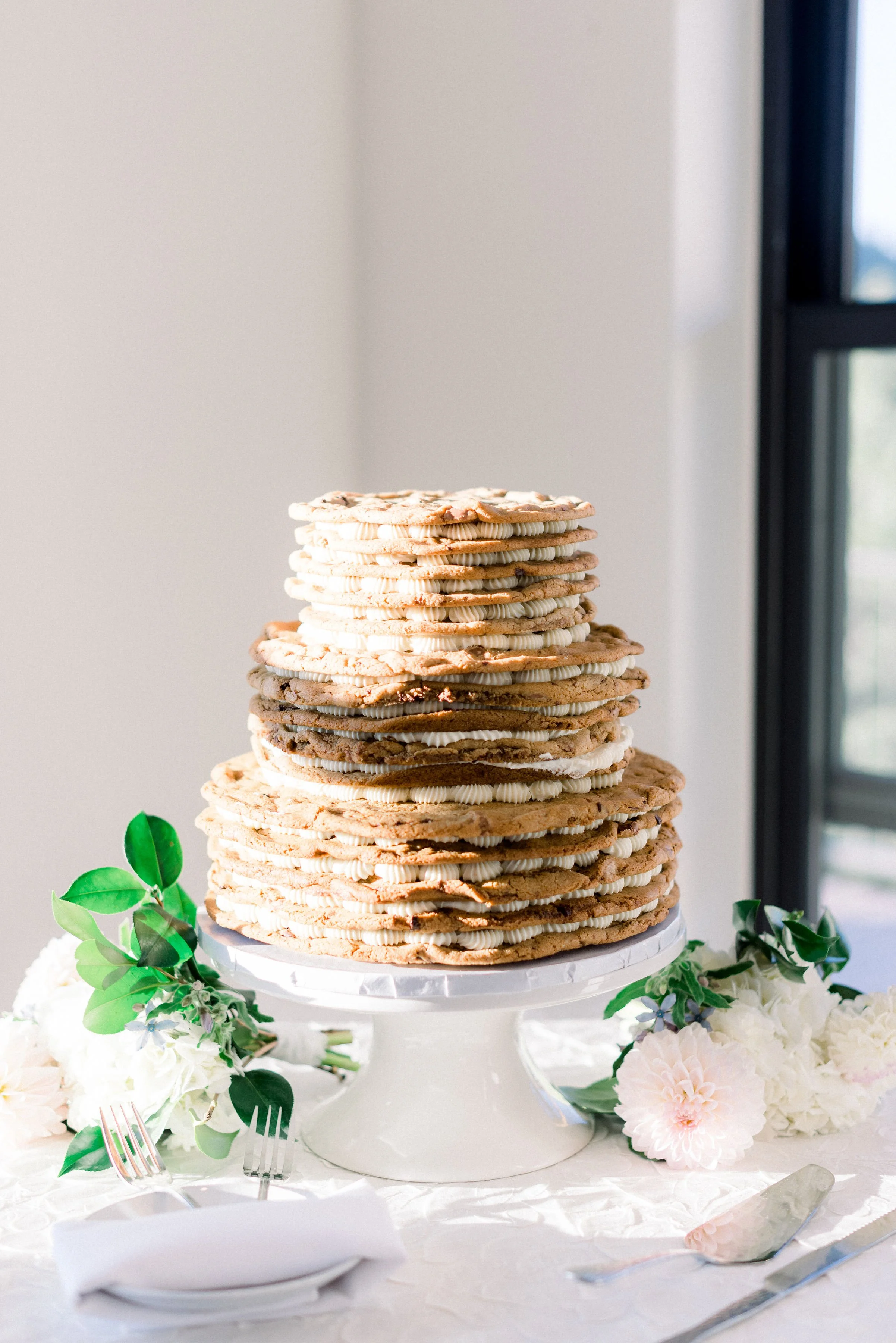 A layered cookie cake for wedding dessert inspiration, prepared by Biscuits and Berries