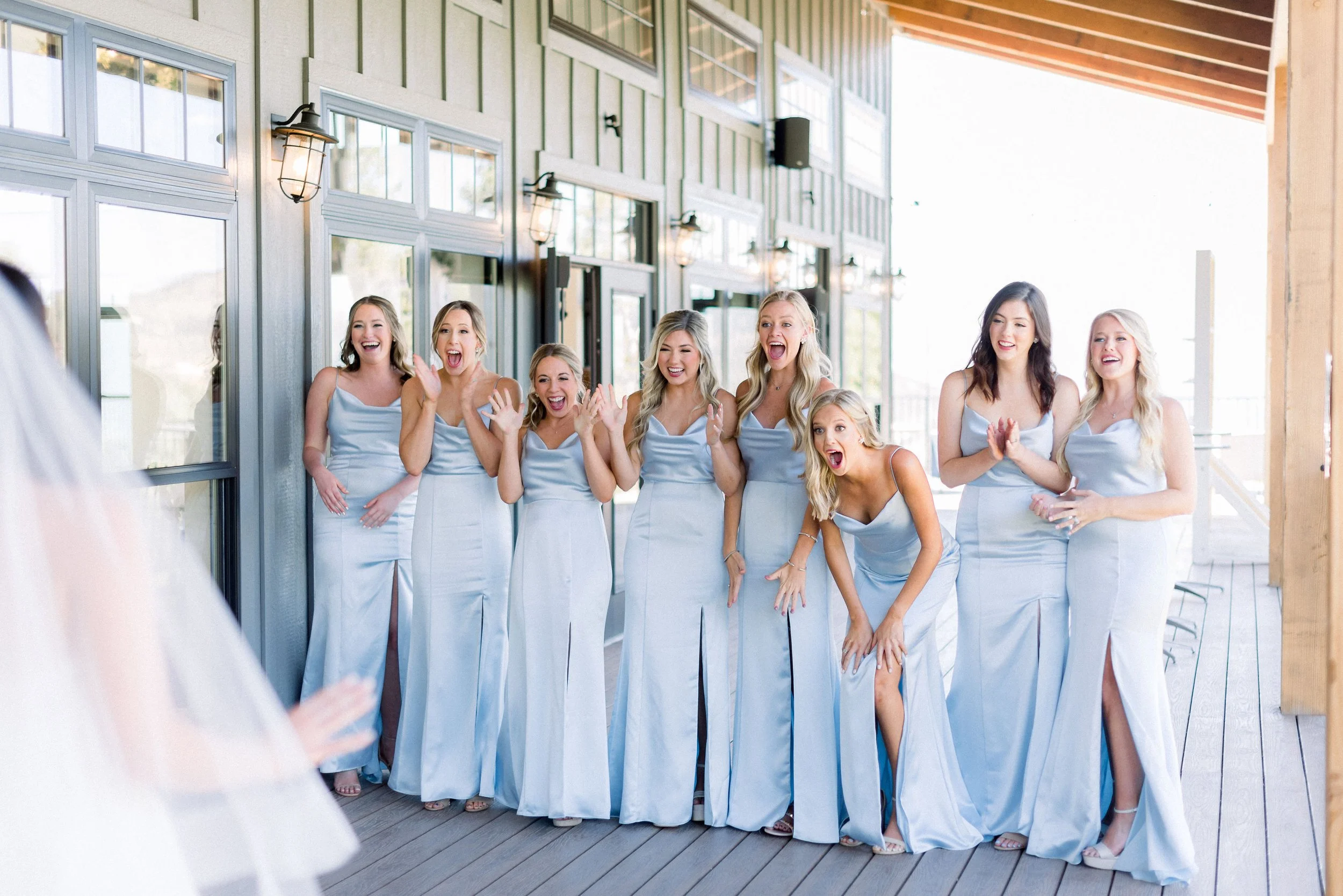 Bridesmaids react to the brides gown for the first time with joy and laughter. We love a great first look!