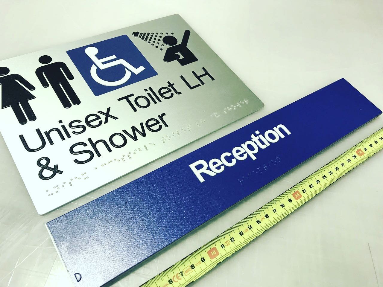 Pushing a few more out the door this morning. Incorporating colour in your design is a great way to add your corporate identity to your compliance signage. #braille #braillesigns #safetysigns #corporatesignage