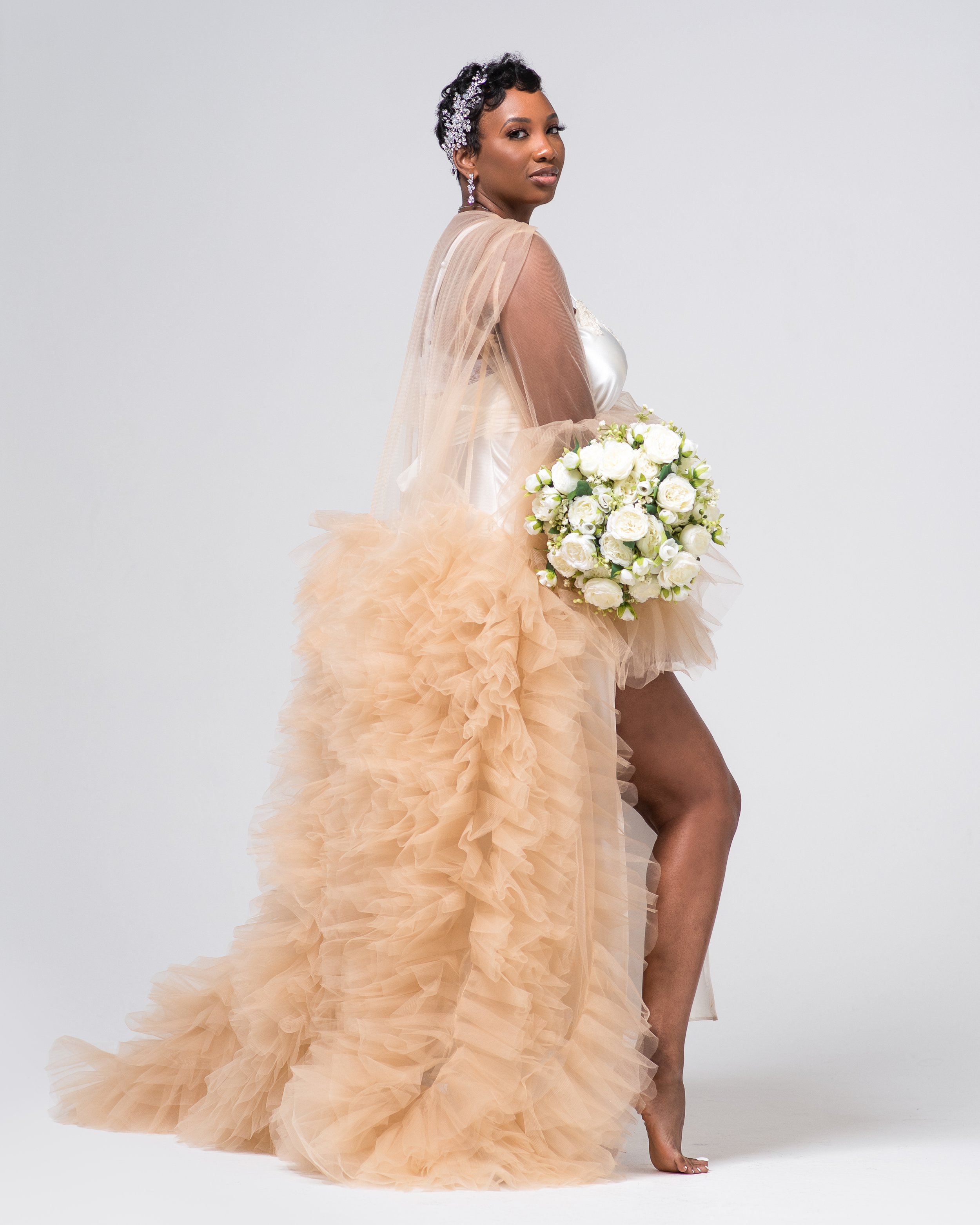 With Dennis Gatz's bridal portraits taken in a studio, every detail is captured perfectly. From the intricate details of the wedding dress to the subtle emotions on the bride's face, every element is expertly composed to create a stunning image.