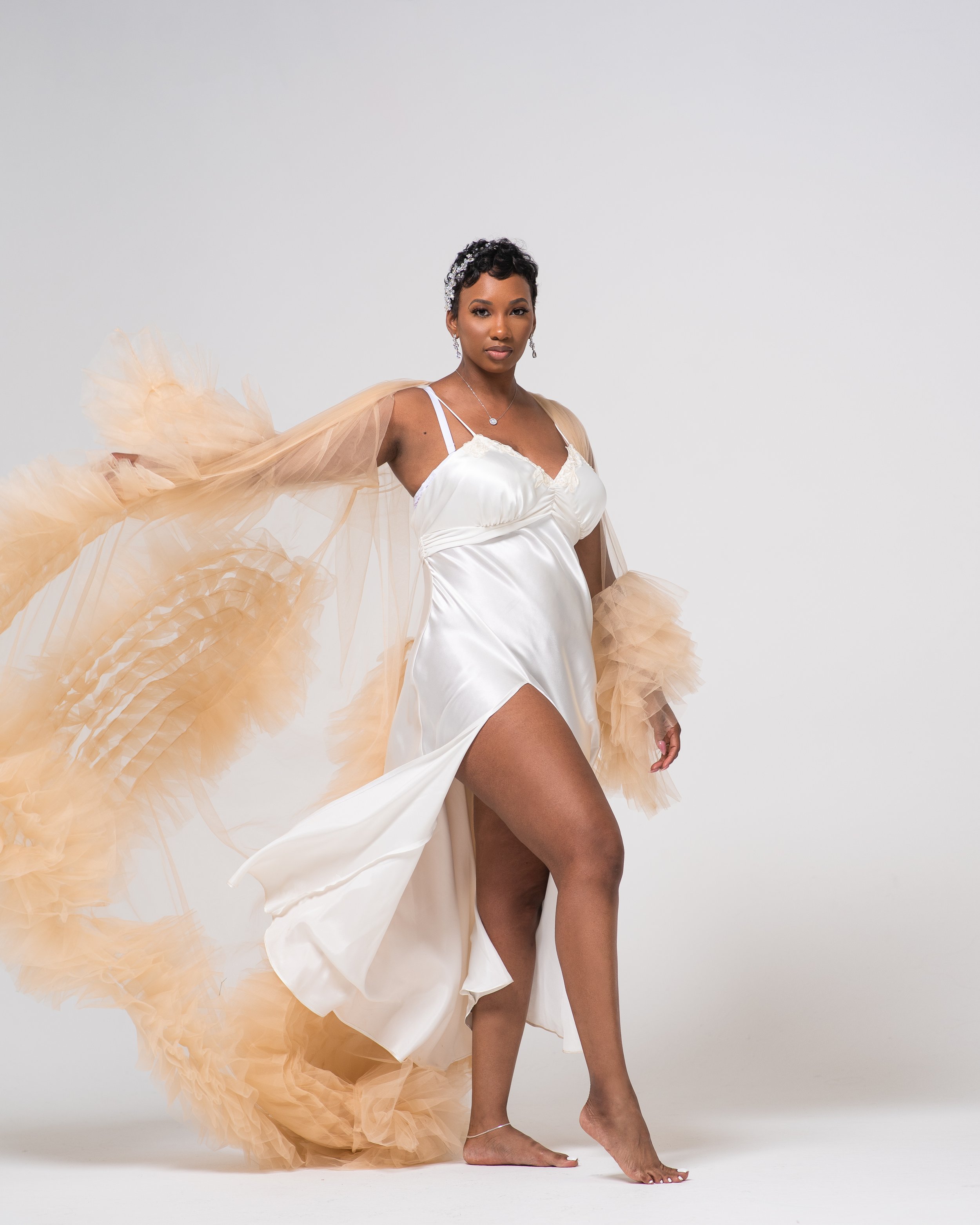 Dennis Gatz's bridal portraits in a studio setting capture the beauty and grace of the bride on her special day. The use of lighting and composition creates a perfect blend of classic elegance and modern sophistication that is sure to impress.