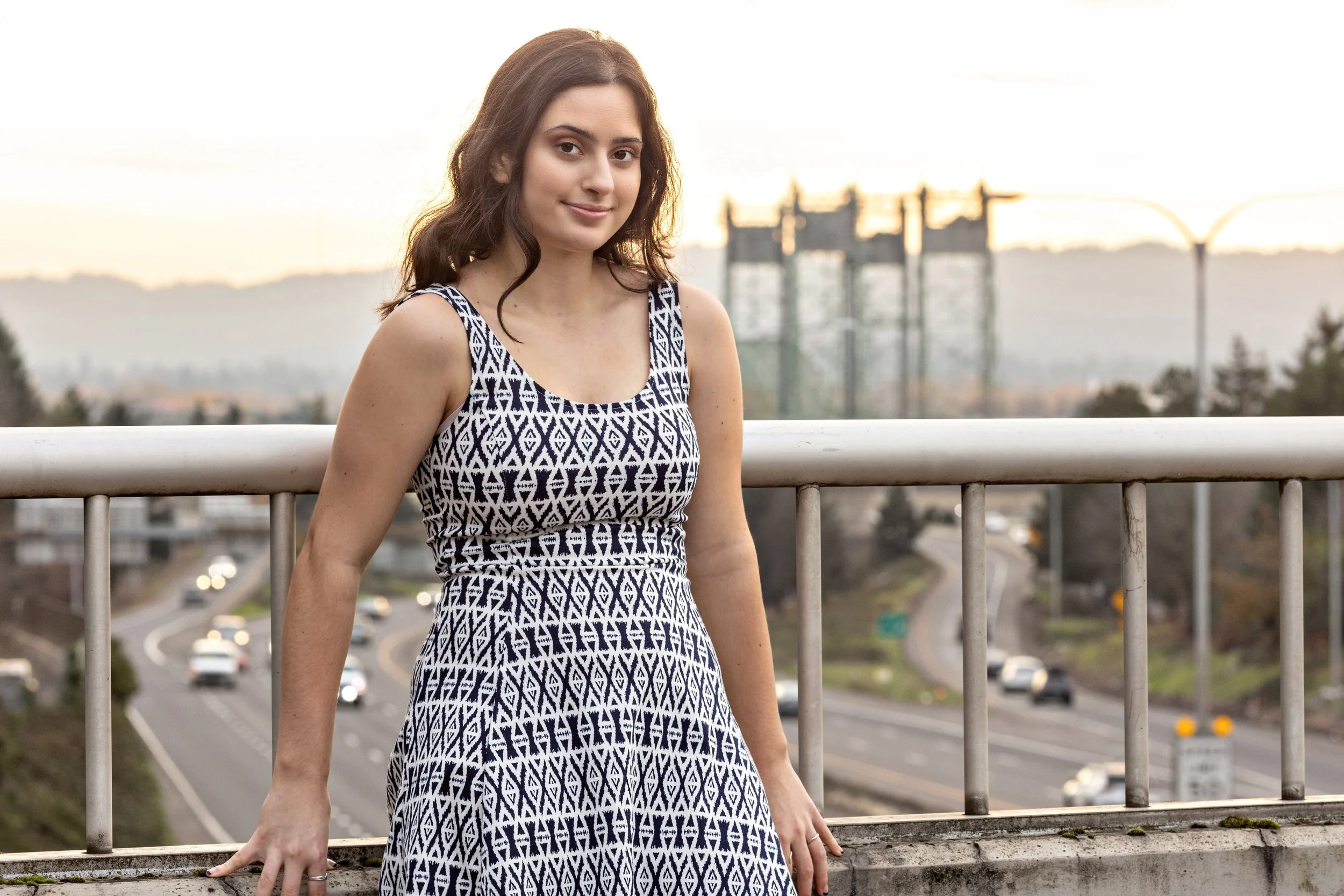 high school senior girl standing on an overpass