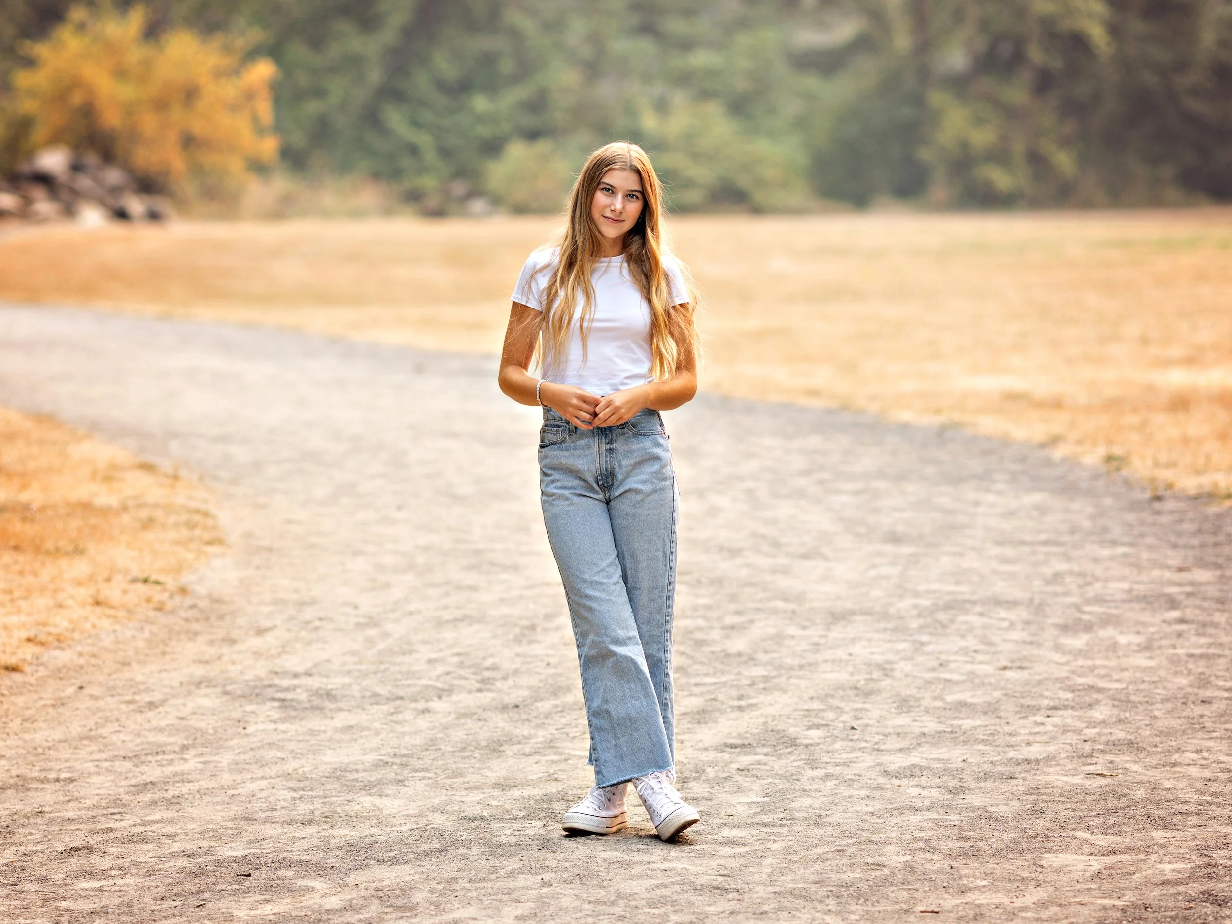 high school senior girl standing on a path