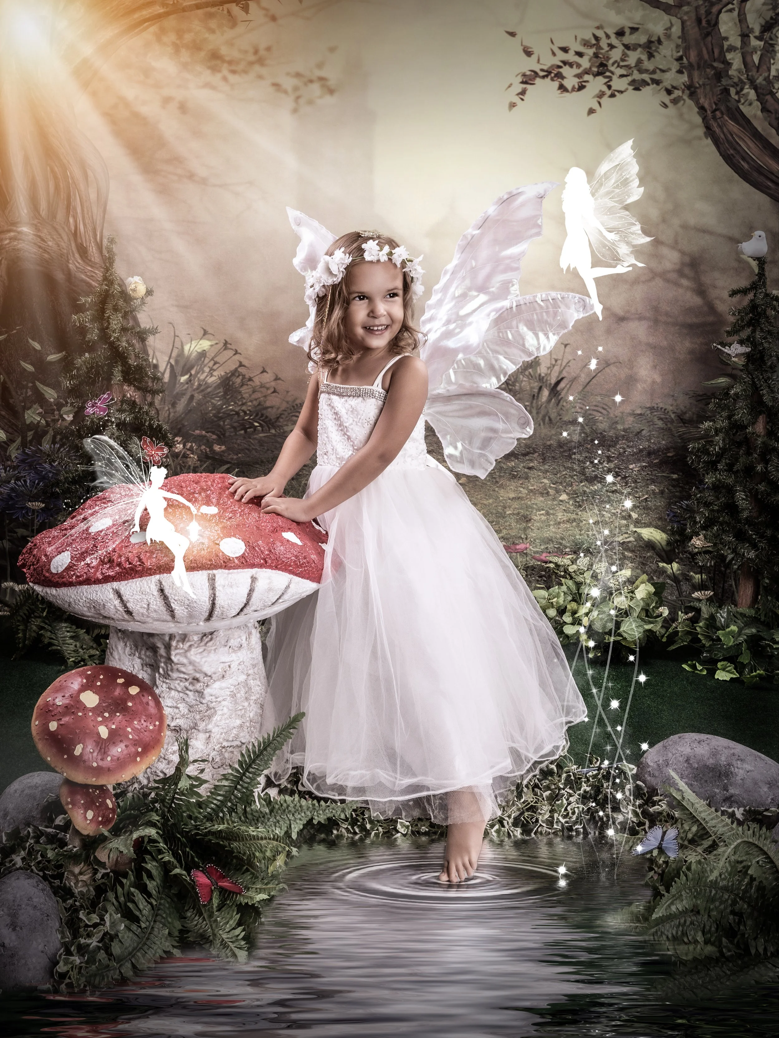 Young girl dressed as a fairy in a magical forest setting, with pink wings and a gown, looking up at a glowing ethereal figure in the sky. A large mushroom and lantern are nearby.