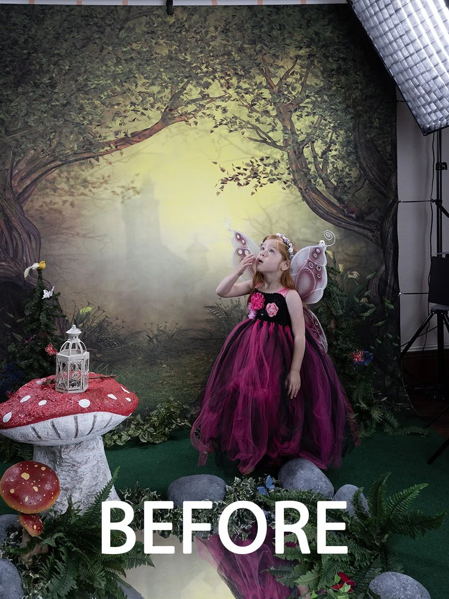Child dressed as a fairy in a forest-themed studio setup with props and lighting equipment.
