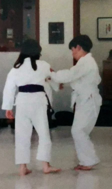 César (right) during his 10th kyu (purple belt) test, c. 2001, at East Bay Aikido, under Tom Gambell Sensei. Uke unknown.