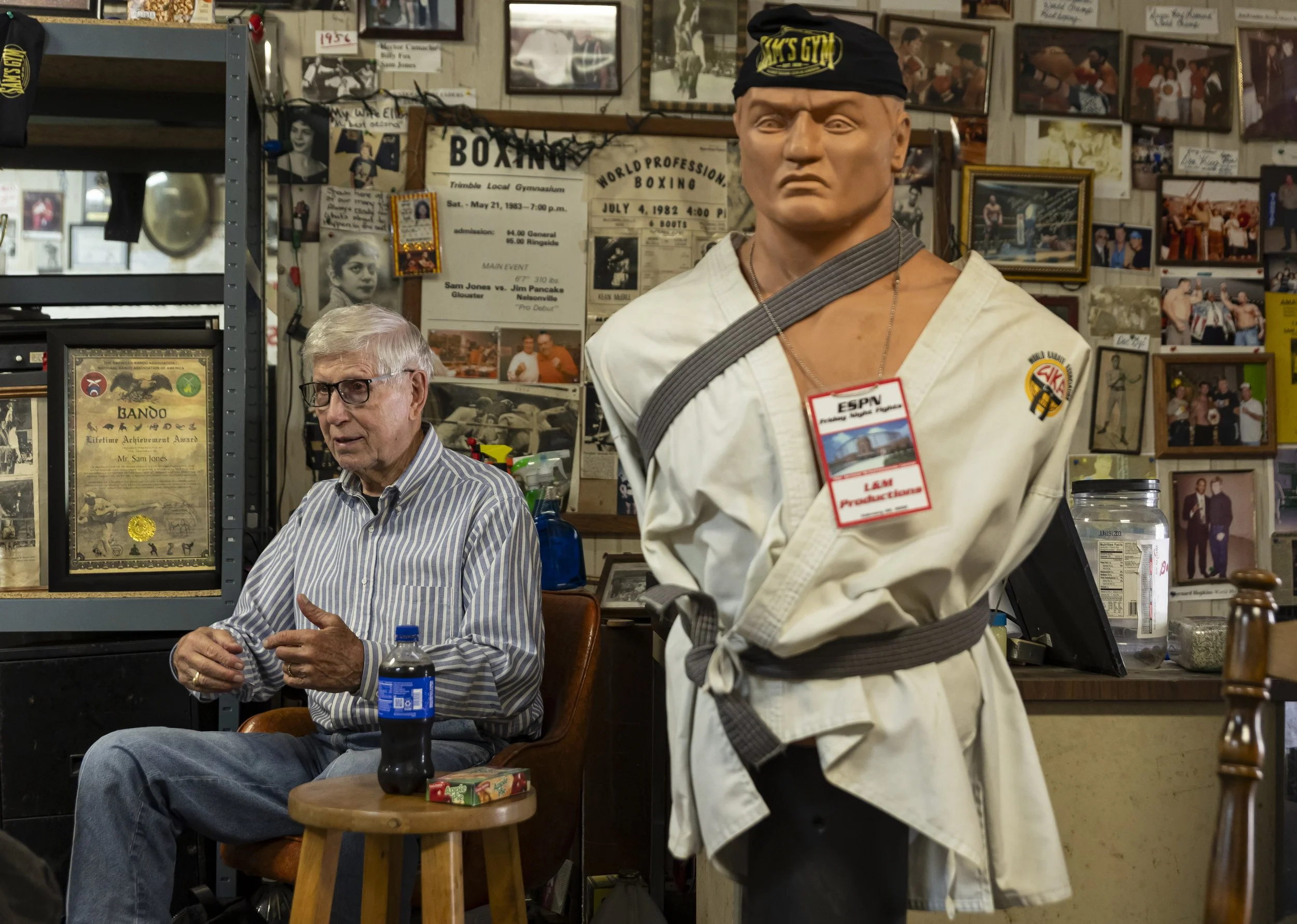 Sam Jones tells stories of his kickboxing days and stories from inside the gym in Sam's Gym in Glouster, Ohio, Sept. 29, 2026. Sam's Gym is the oldest running boxing gym in the United States, having been opened in 1936 by Jones' grandfather that he i