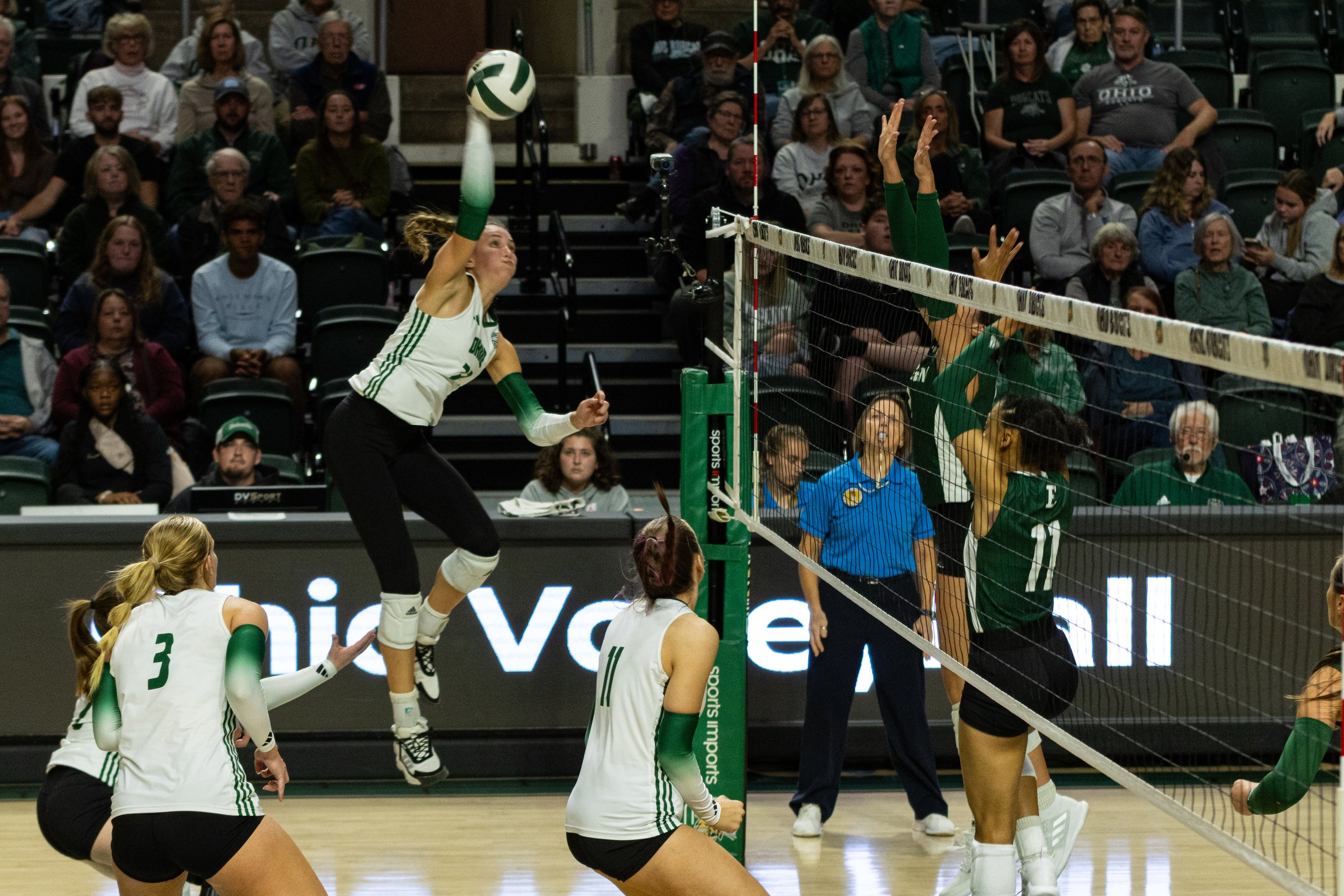 Ohio Bobcats outside hitter Kam Hunt (23) spikes the ball against Eastern Michigan at the Convocation Center at Ohio University in Athens, Ohio, Nov. 3, 2023 | Shot for The Post