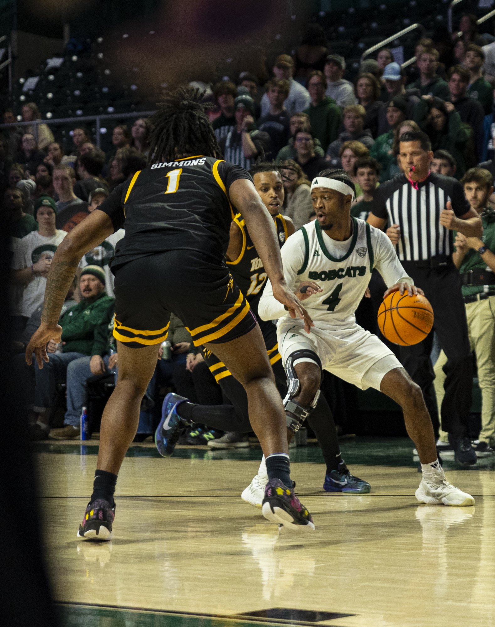 Ohio Bobcats guard Shereef Mitchell (4) fights off a defender against Toledo in The Convo in Athens, Jan. 28, 2025.